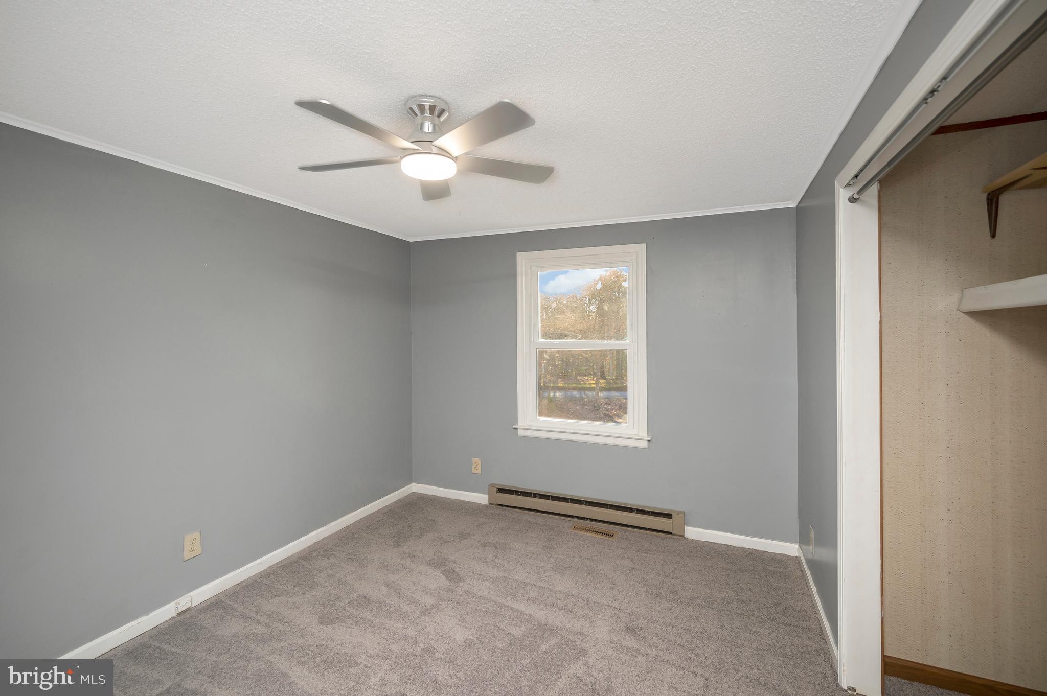 12402 Toll House Road Spotsylvania, VA 22551 - Photo 36 of 59 an empty room with windows and fan