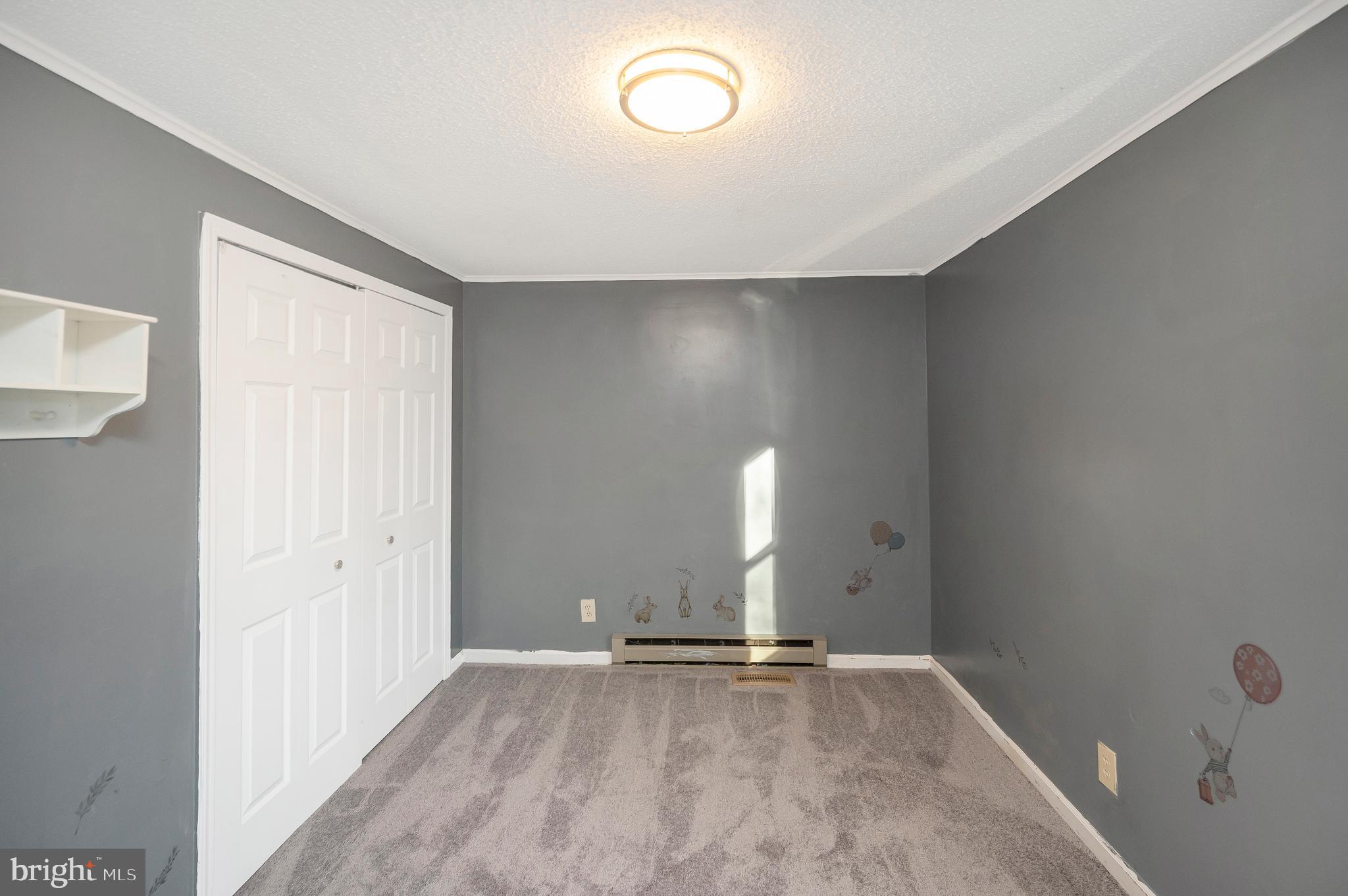 12402 Toll House Road Spotsylvania, VA 22551 - Photo 41 of 59 an empty room with wooden floor and windows