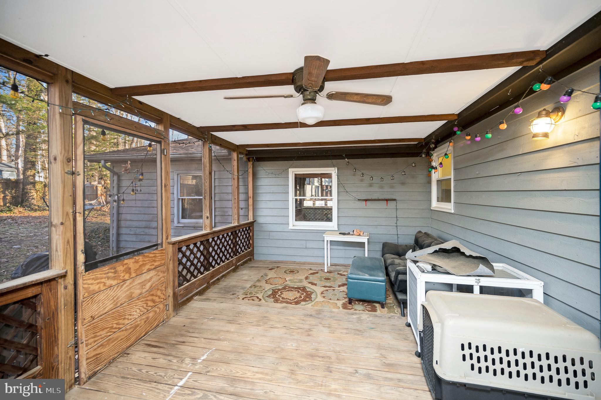 12402 Toll House Road Spotsylvania, VA 22551 - Photo 43 of 59 a view of a patio with a table and chairs