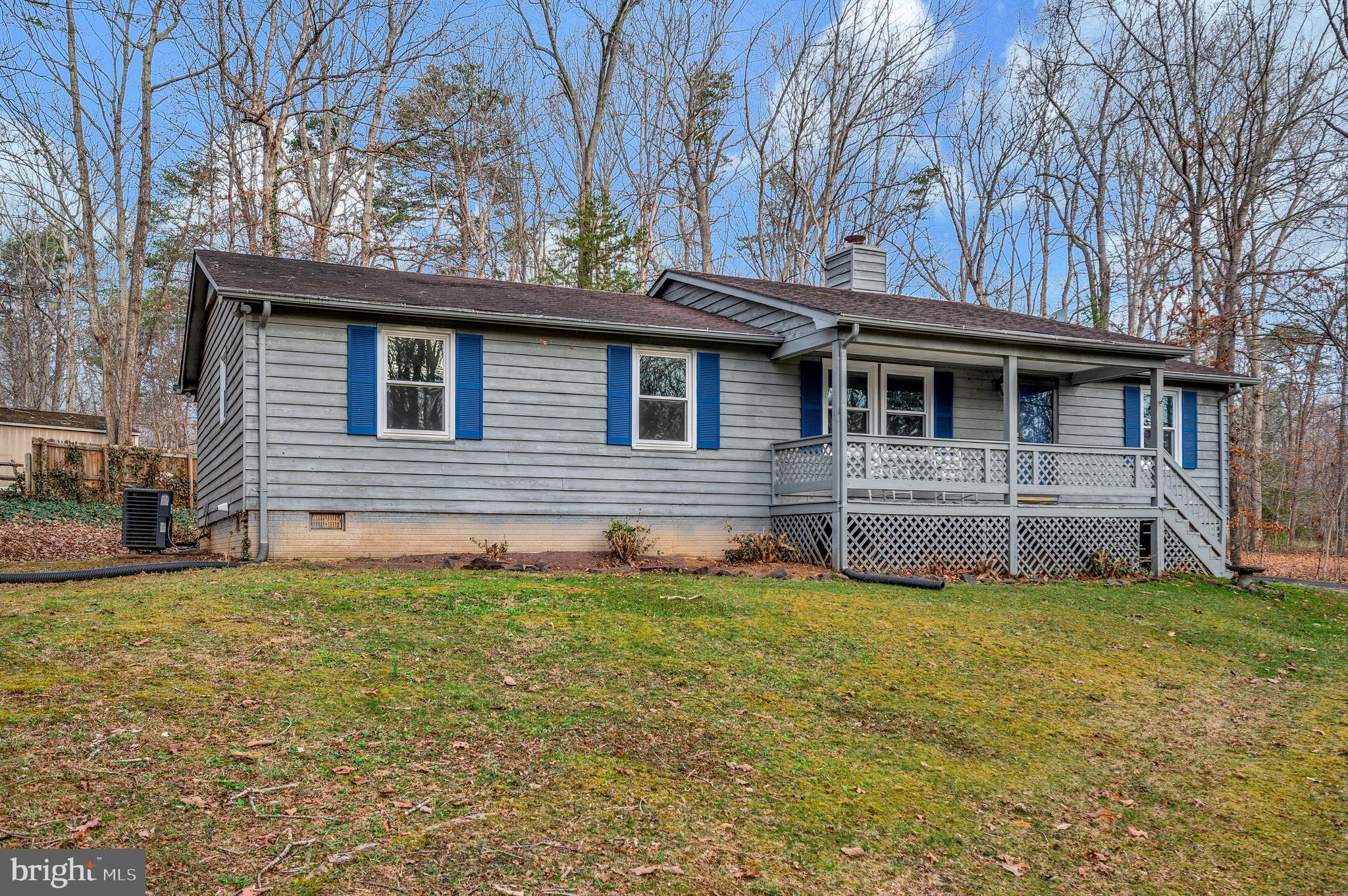 12402 Toll House Road Spotsylvania, VA 22551 - Photo 5 of 59 a house that has a big yard plants and large tree