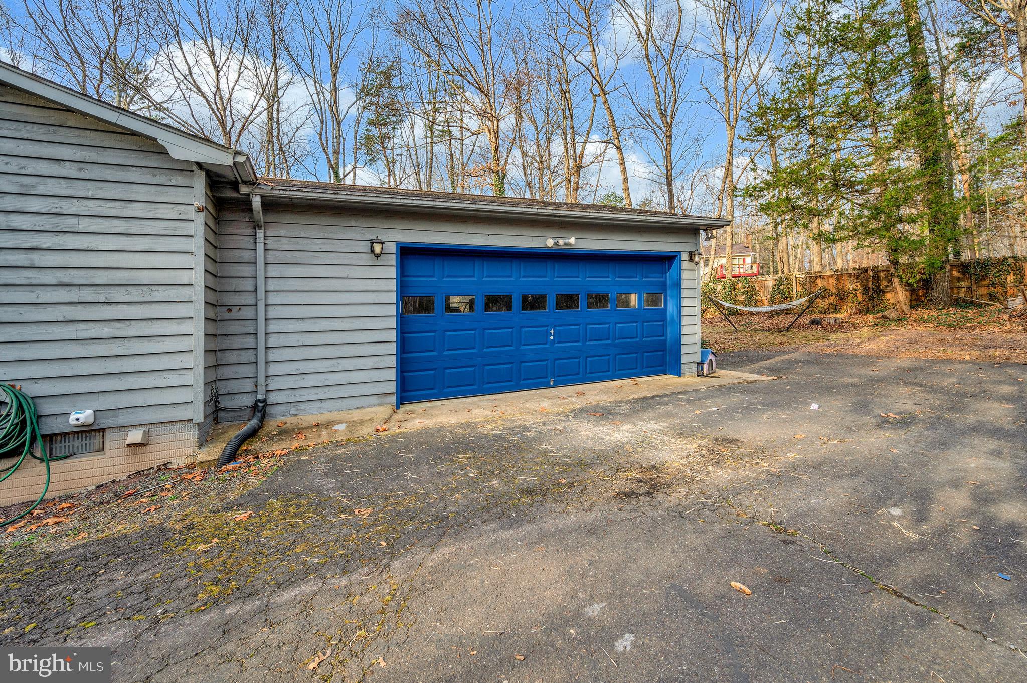 12402 Toll House Road Spotsylvania, VA 22551 - Photo 52 of 59 a house with trees in the background