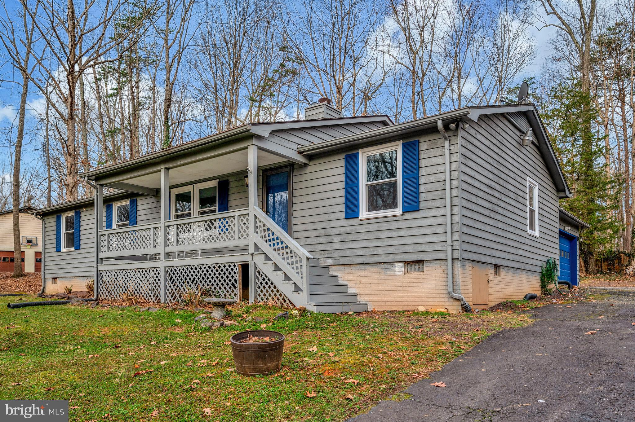 12402 Toll House Road Spotsylvania, VA 22551 - Photo 6 of 59 a white house with a large window and yard in the back