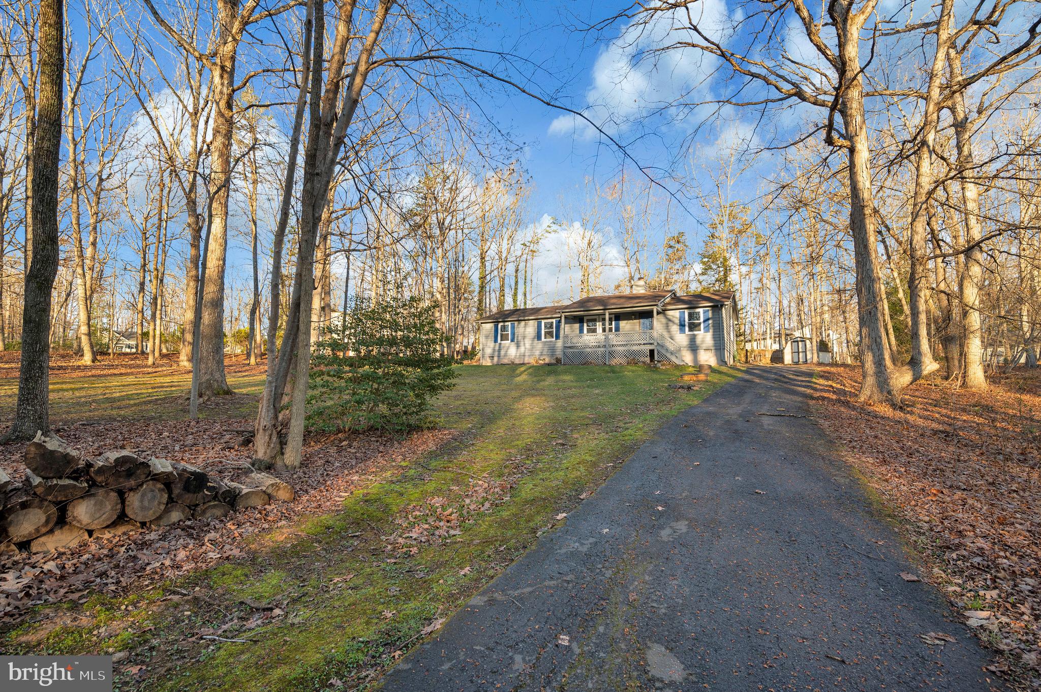 12402 Toll House Road Spotsylvania, VA 22551 - Photo 8 of 59 a view of a yard with large trees