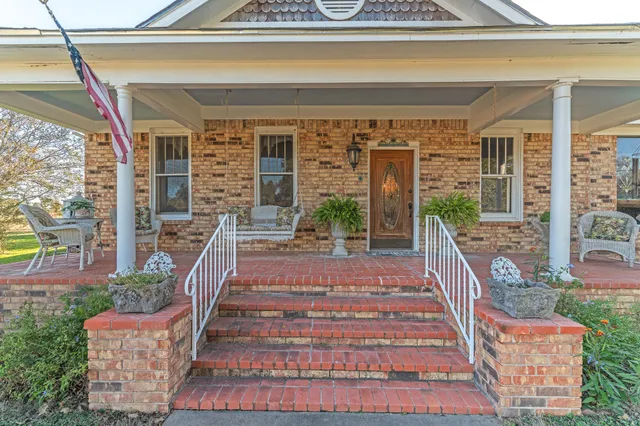 a front view of a house with a porch