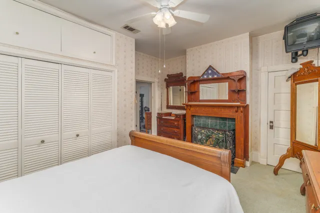 a living room with fireplace furniture and a chandelier