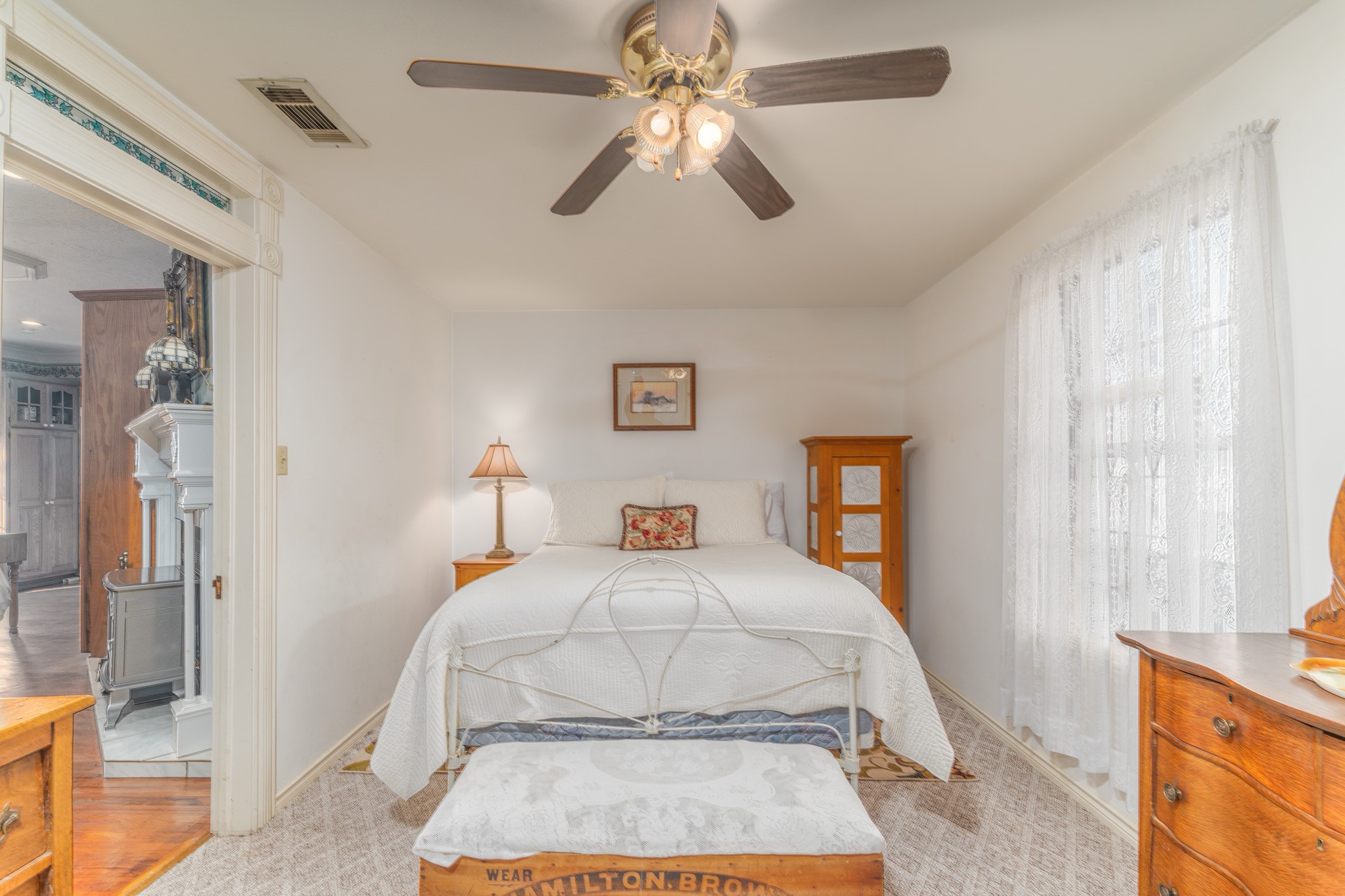 6184 Farm To Market 485 Cameron, TX 76520 - Photo 26 of 34 a bedroom with a bed and a chandelier