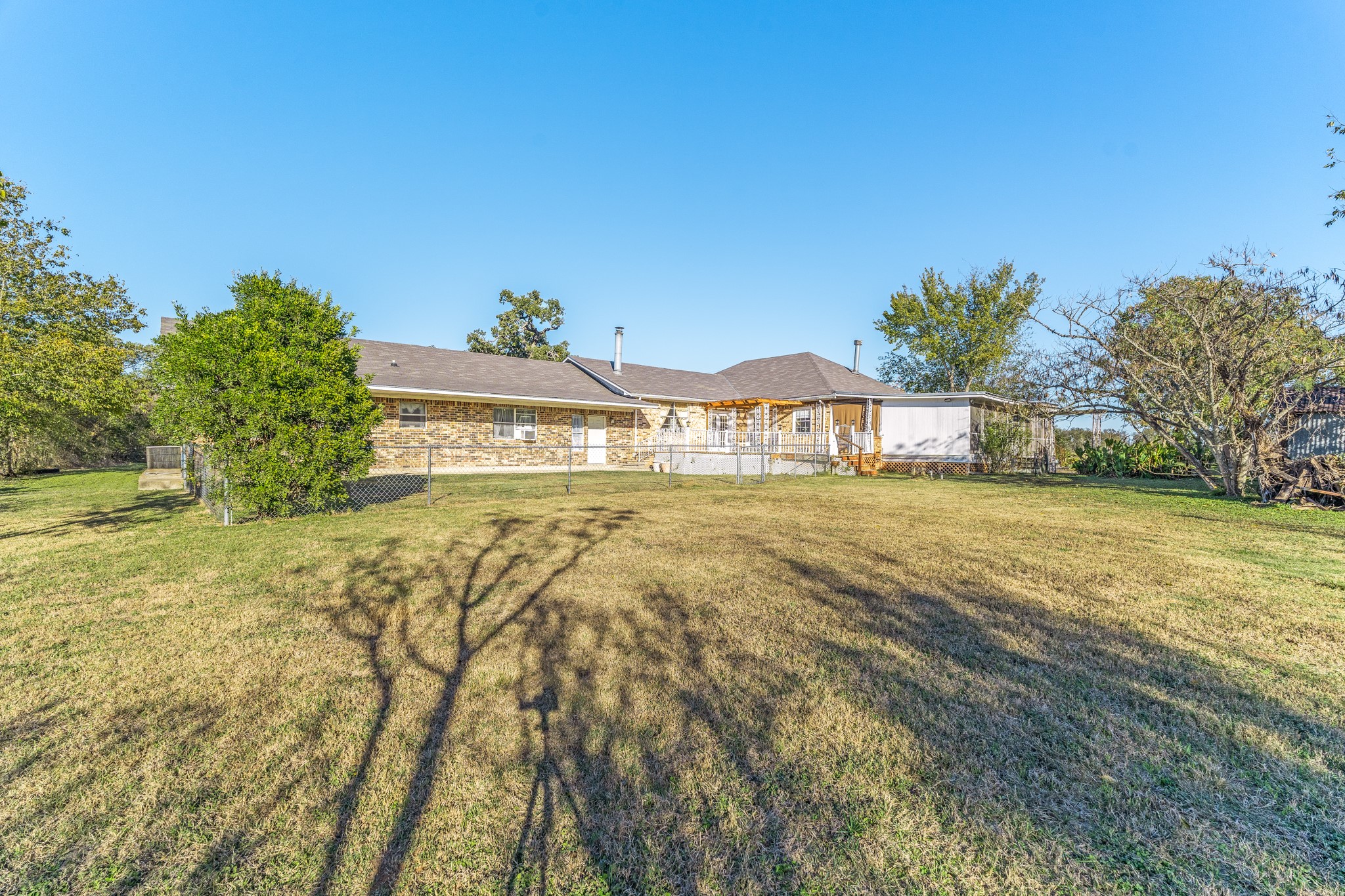 6184 Farm To Market 485 Cameron, TX 76520 - Photo 7 of 34 a view of an house with backyard and trees