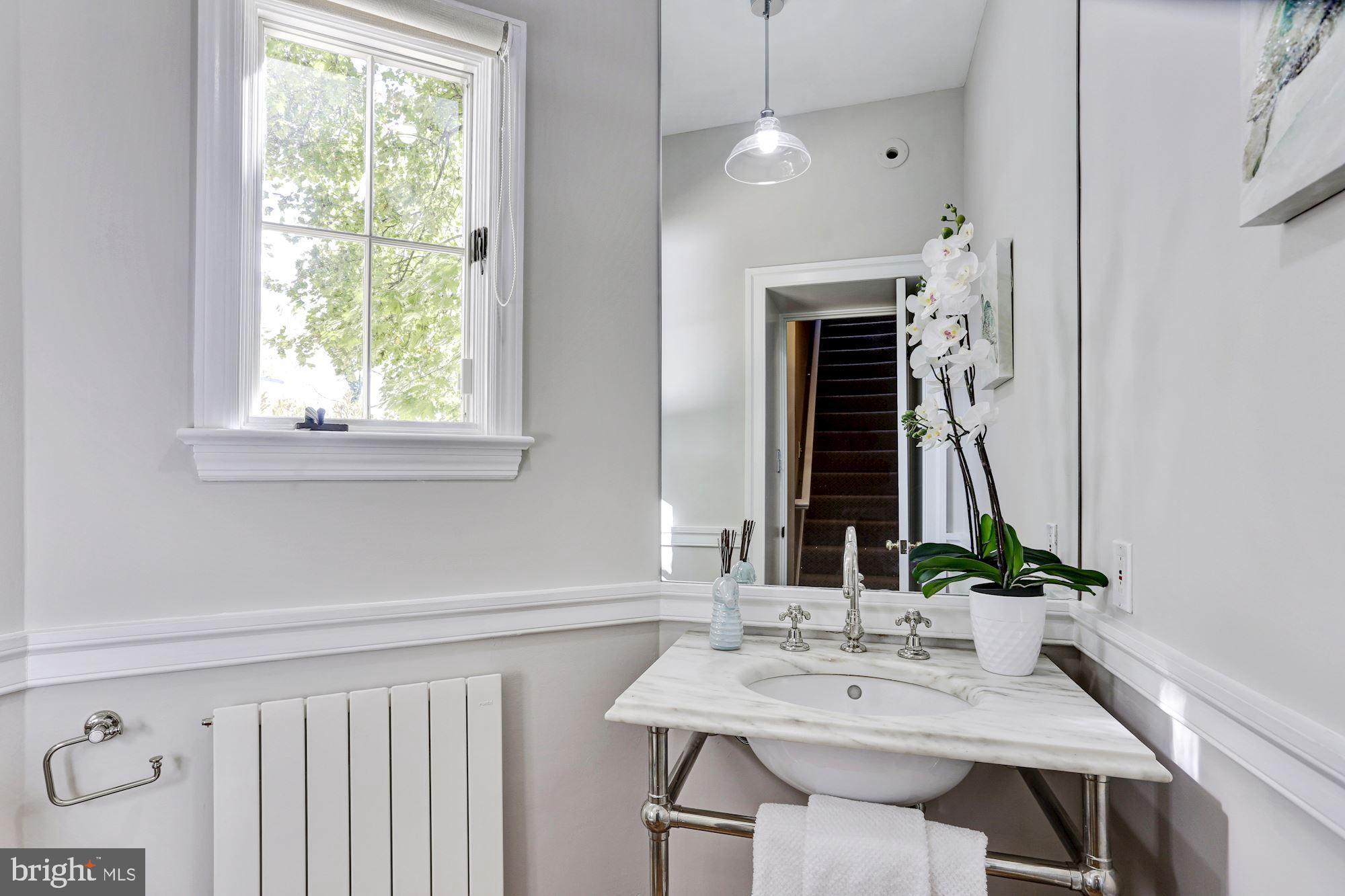 3306 R Street Northwest Washington, DC 20007 - Photo 12 of 38 Main-level powder room with marble