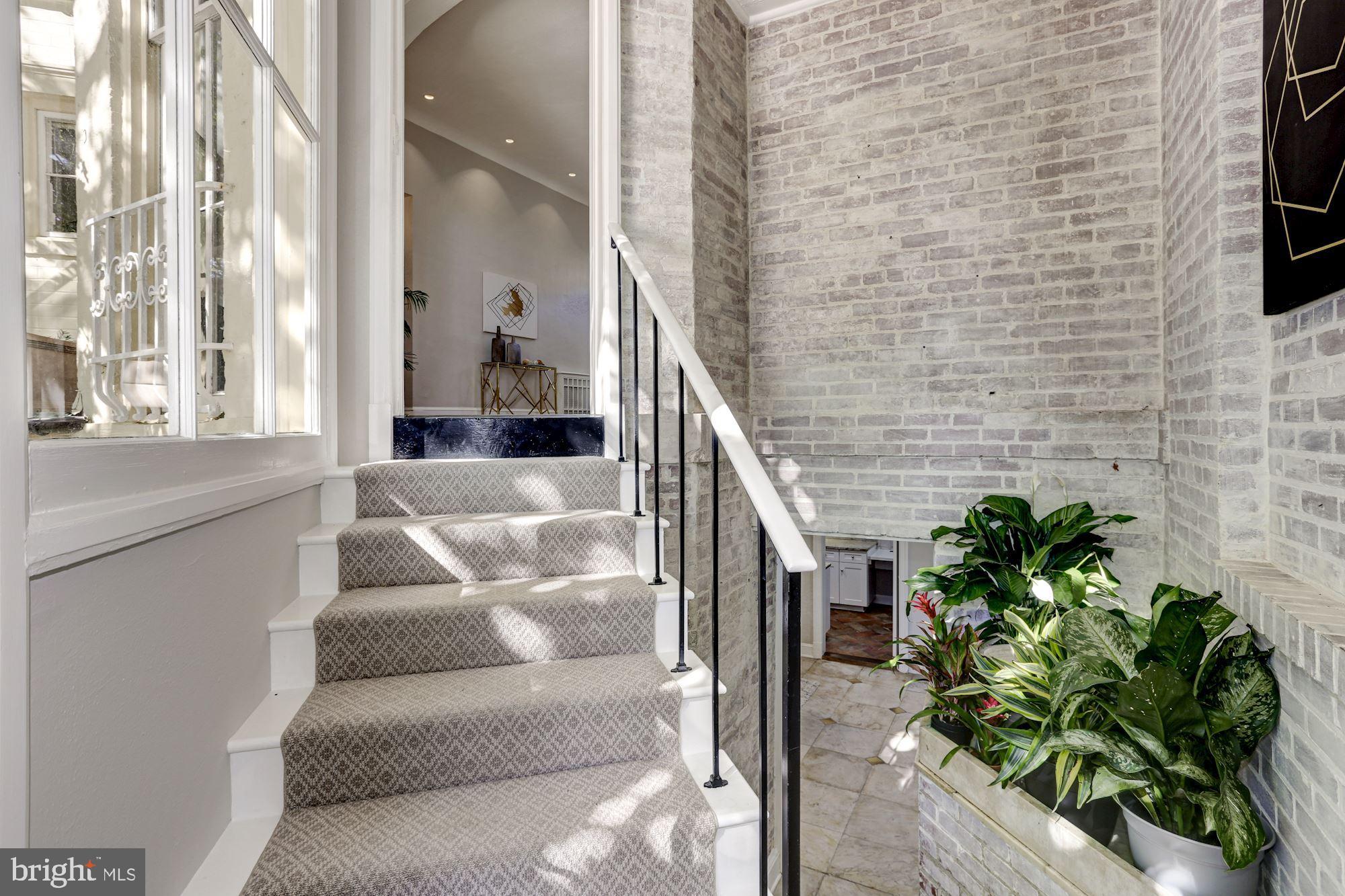 3306 R Street Northwest Washington, DC 20007 - Photo 13 of 38 Exposed white-washed brick stairwell