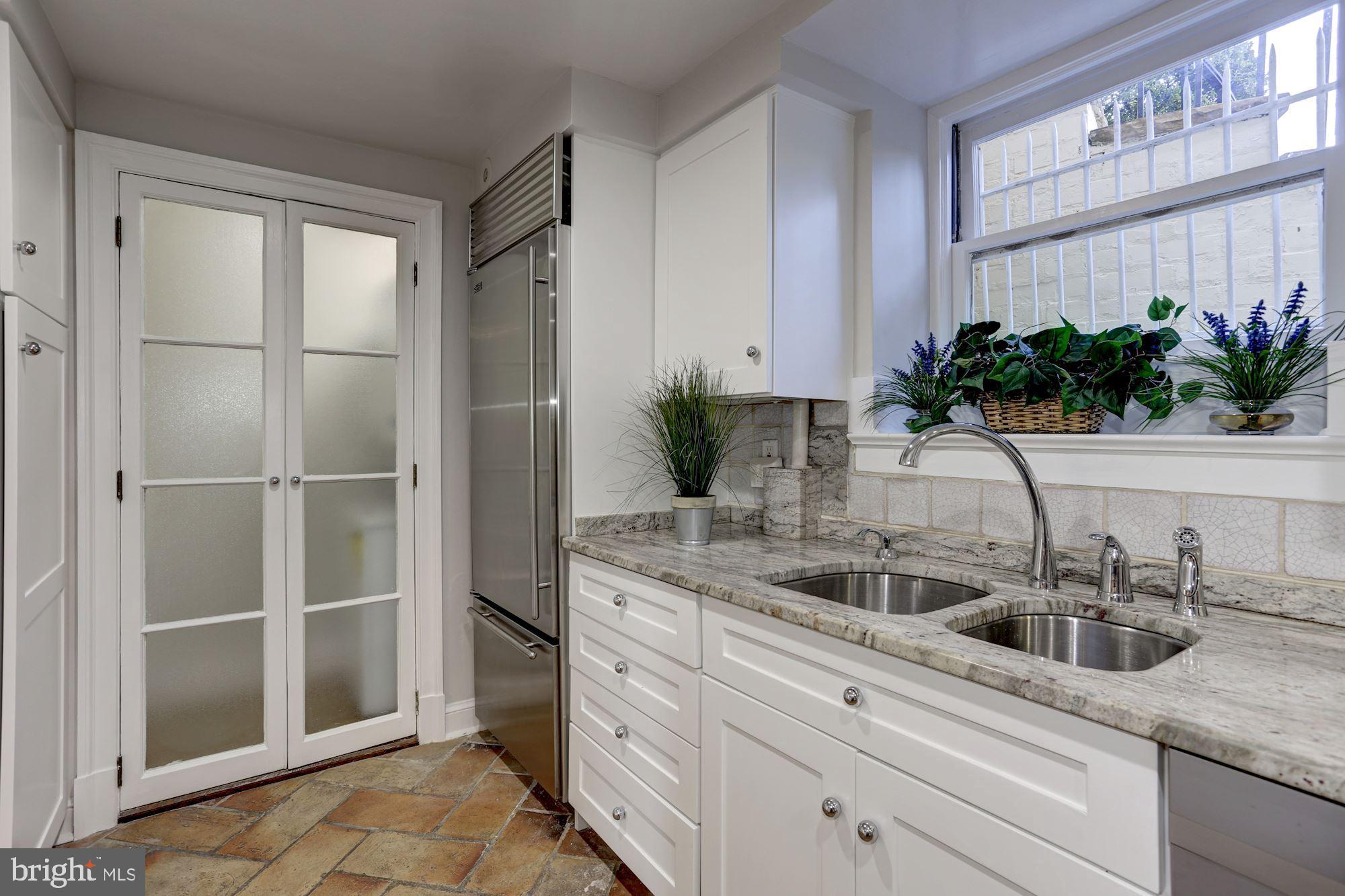3306 R Street Northwest Washington, DC 20007 - Photo 23 of 38 Bright lower-level kitchen