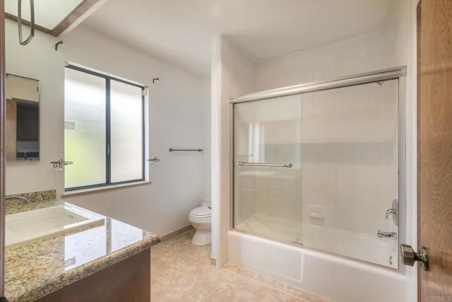 a utility room with sink dryer and washer