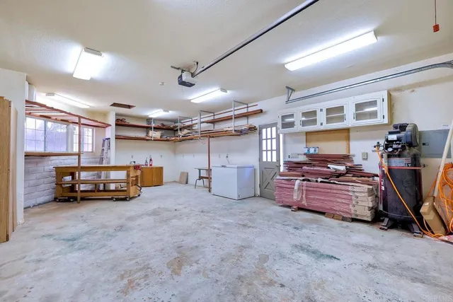 an empty room with bookshelf and wooden shelves