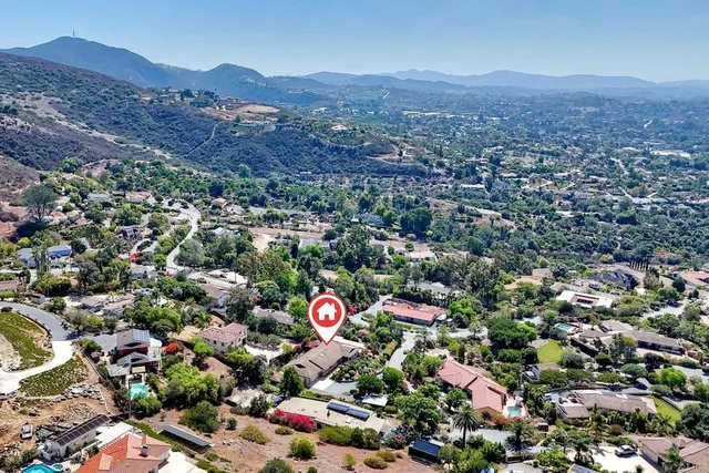 an aerial view of house with yard