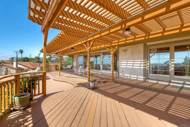 a view of a patio with a table and chairs