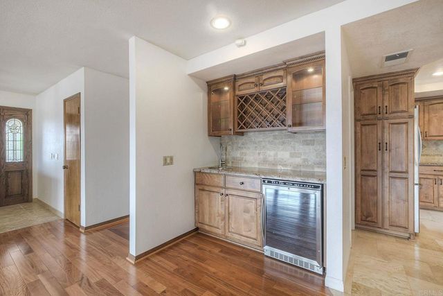 an entryway with wooden floor