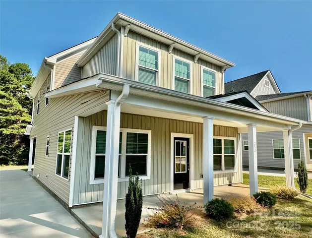 a front view of a house with a porch