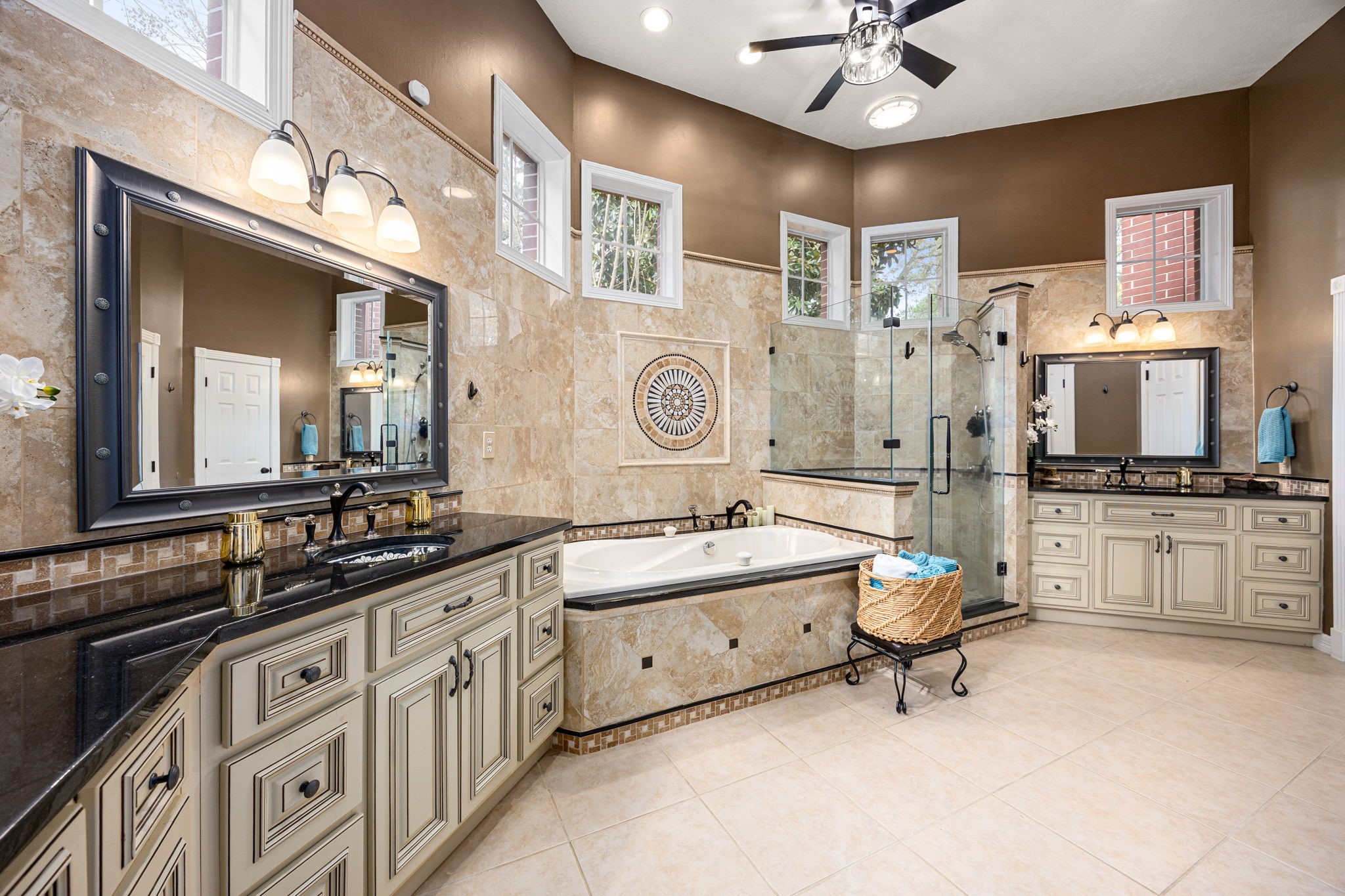 17511 Hawkin Lane Tomball, TX 77377 - Photo 23 of 50 a spacious bathroom with a double vanity sink a mirror a bathtub and a shower