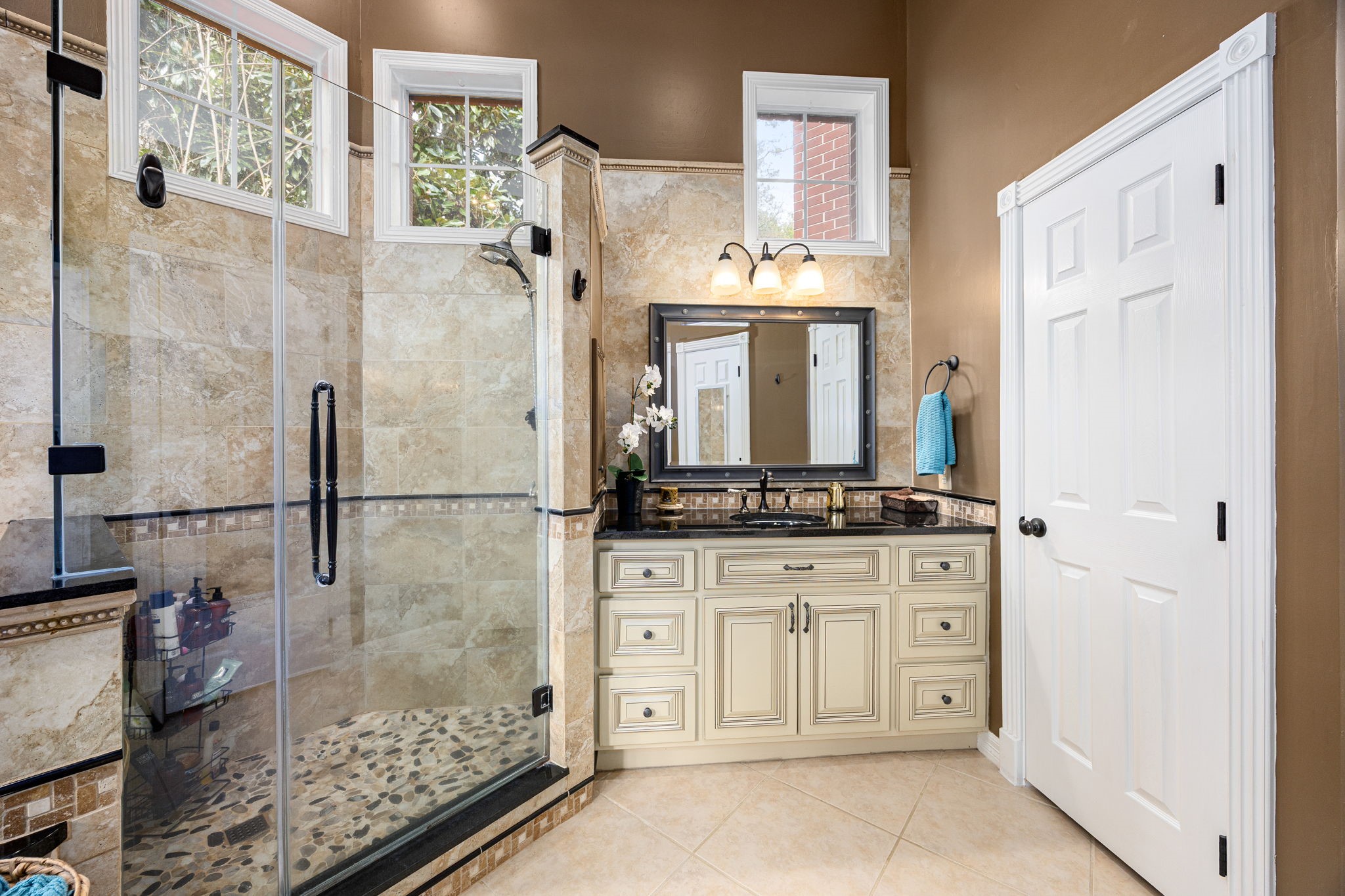 17511 Hawkin Lane Tomball, TX 77377 - Photo 24 of 50 a bathroom with a granite countertop sink a mirror and shower