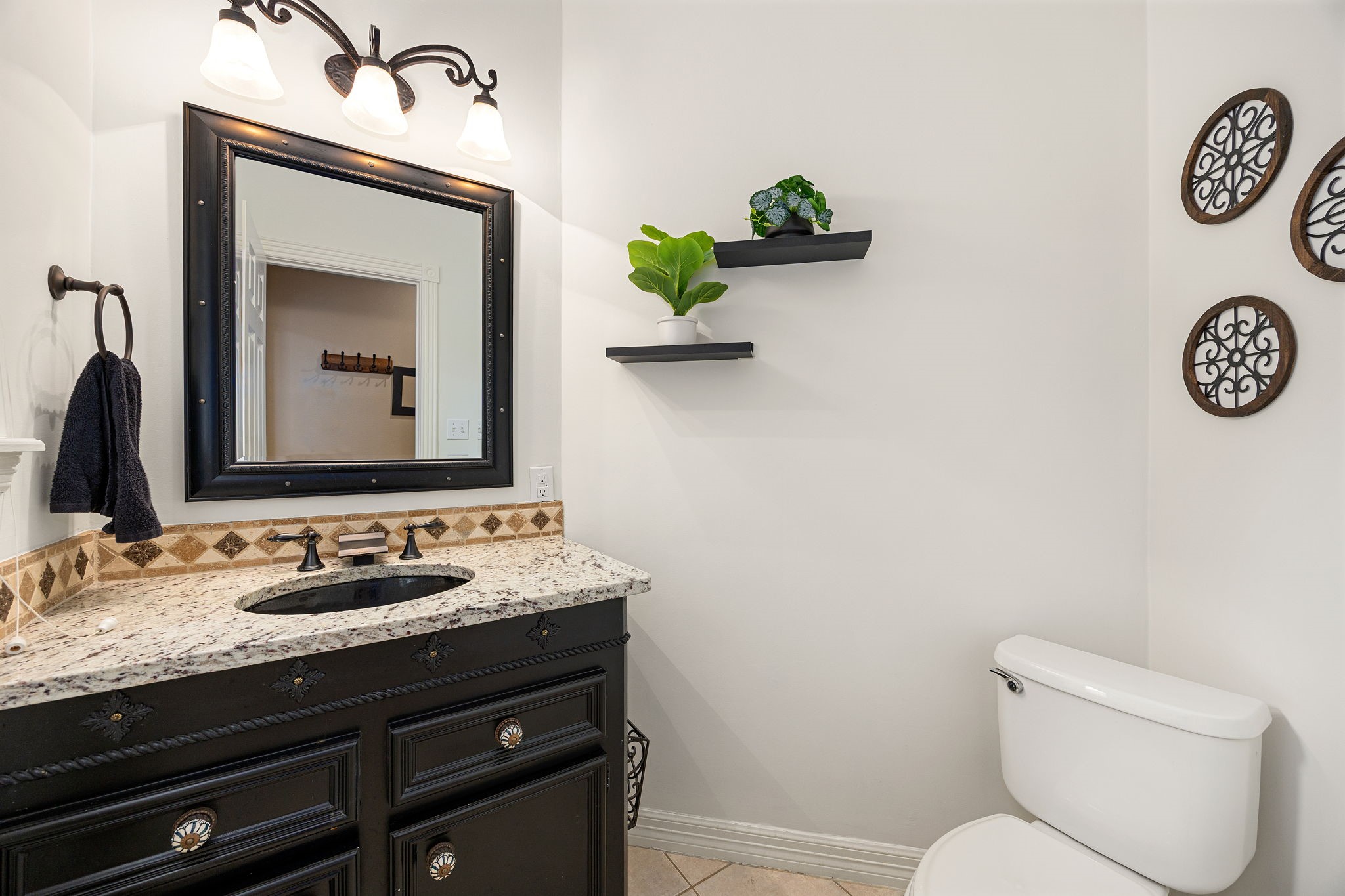 17511 Hawkin Lane Tomball, TX 77377 - Photo 26 of 50 a bathroom with a toilet sink and mirror