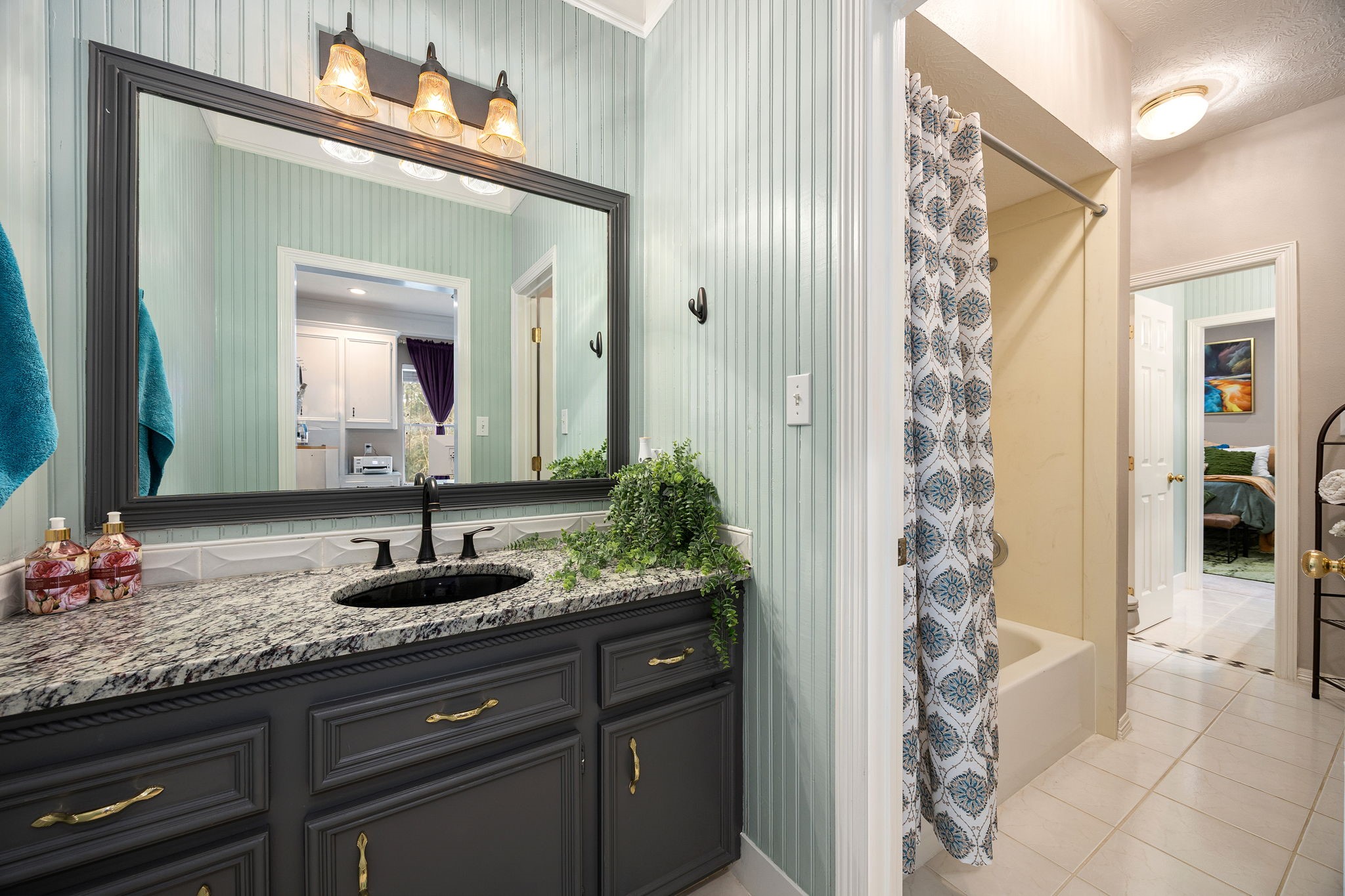 17511 Hawkin Lane Tomball, TX 77377 - Photo 37 of 50 a bathroom with a granite countertop sink and a mirror