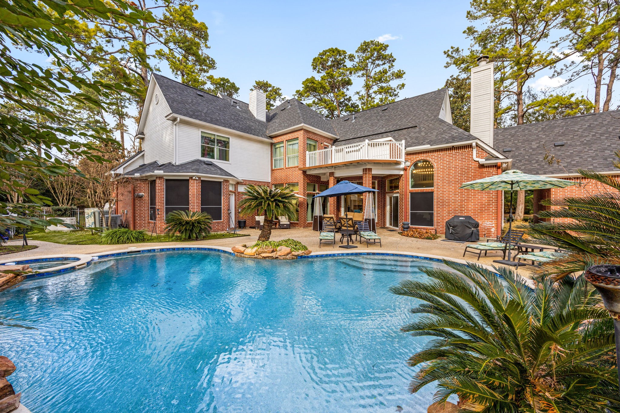 17511 Hawkin Lane Tomball, TX 77377 - Photo 41 of 49 a view of a patio with swimming pool table and chairs