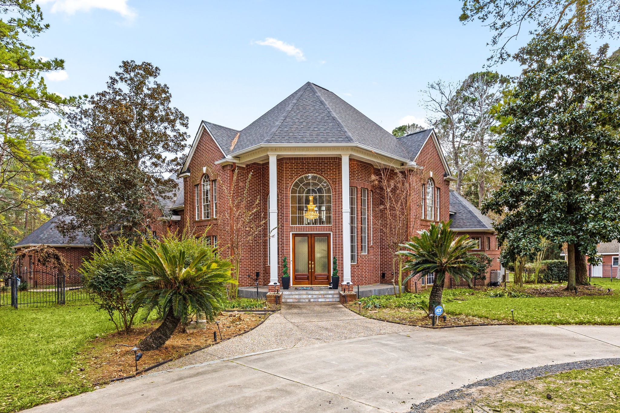 17511 Hawkin Lane Tomball, TX 77377 - Photo 5 of 49 a front view of a house with a garden and plants