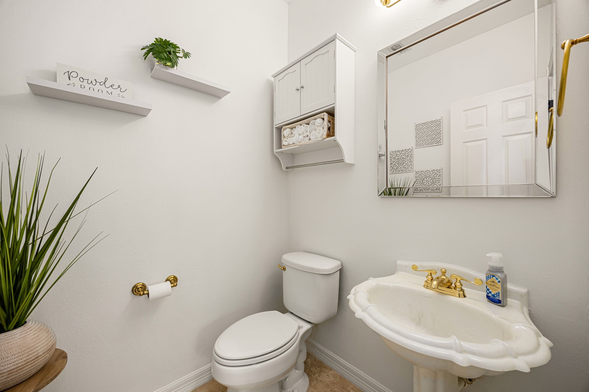17511 Hawkin Lane Tomball, TX 77377 - Photo 9 of 50 a white toilet sitting next to a bathroom sink
