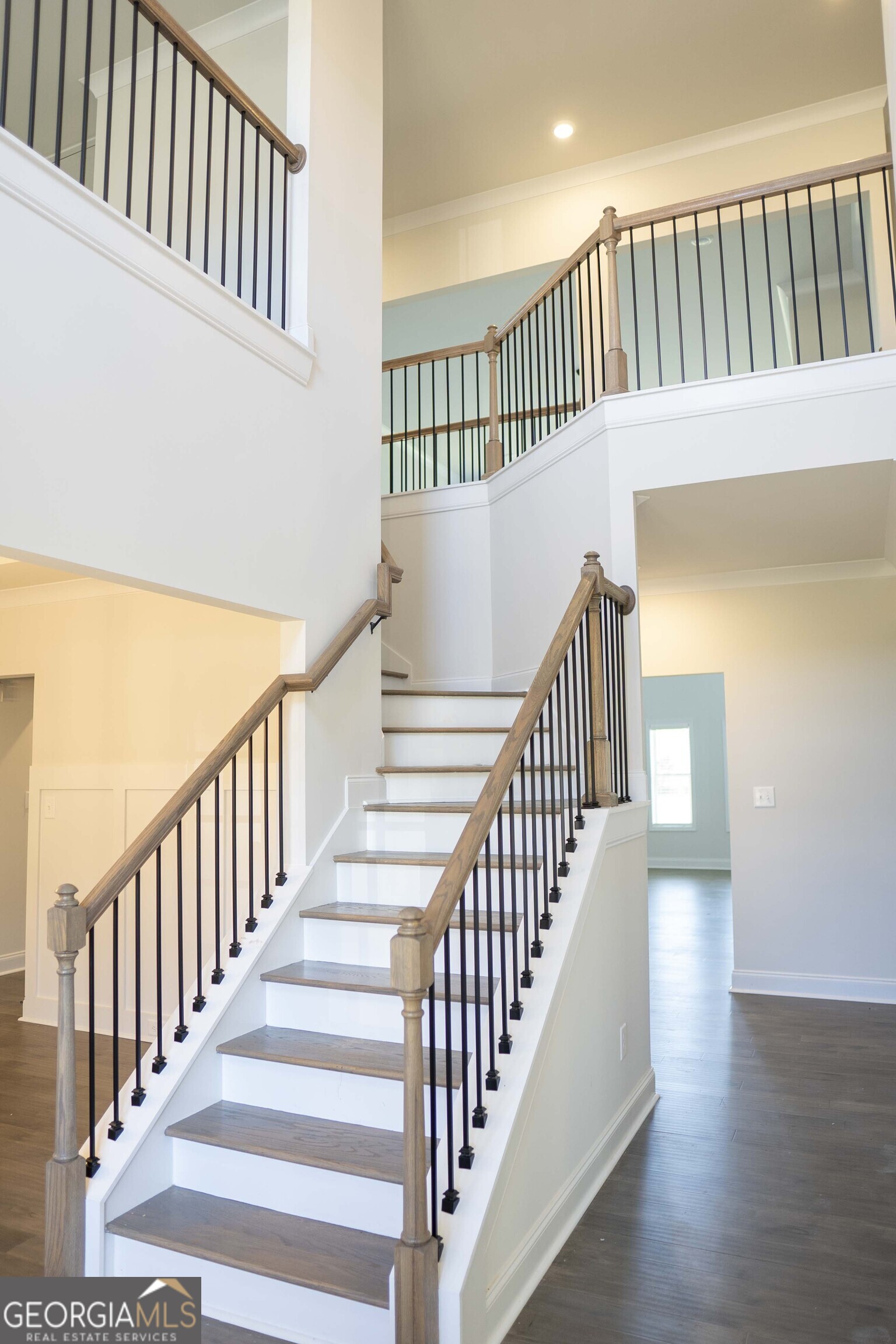 600 Beaver Court Perry, GA 31069 - Photo 27 of 48 a view of staircase with wooden floor and white walls