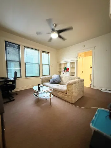 an empty room with a empty space and windows