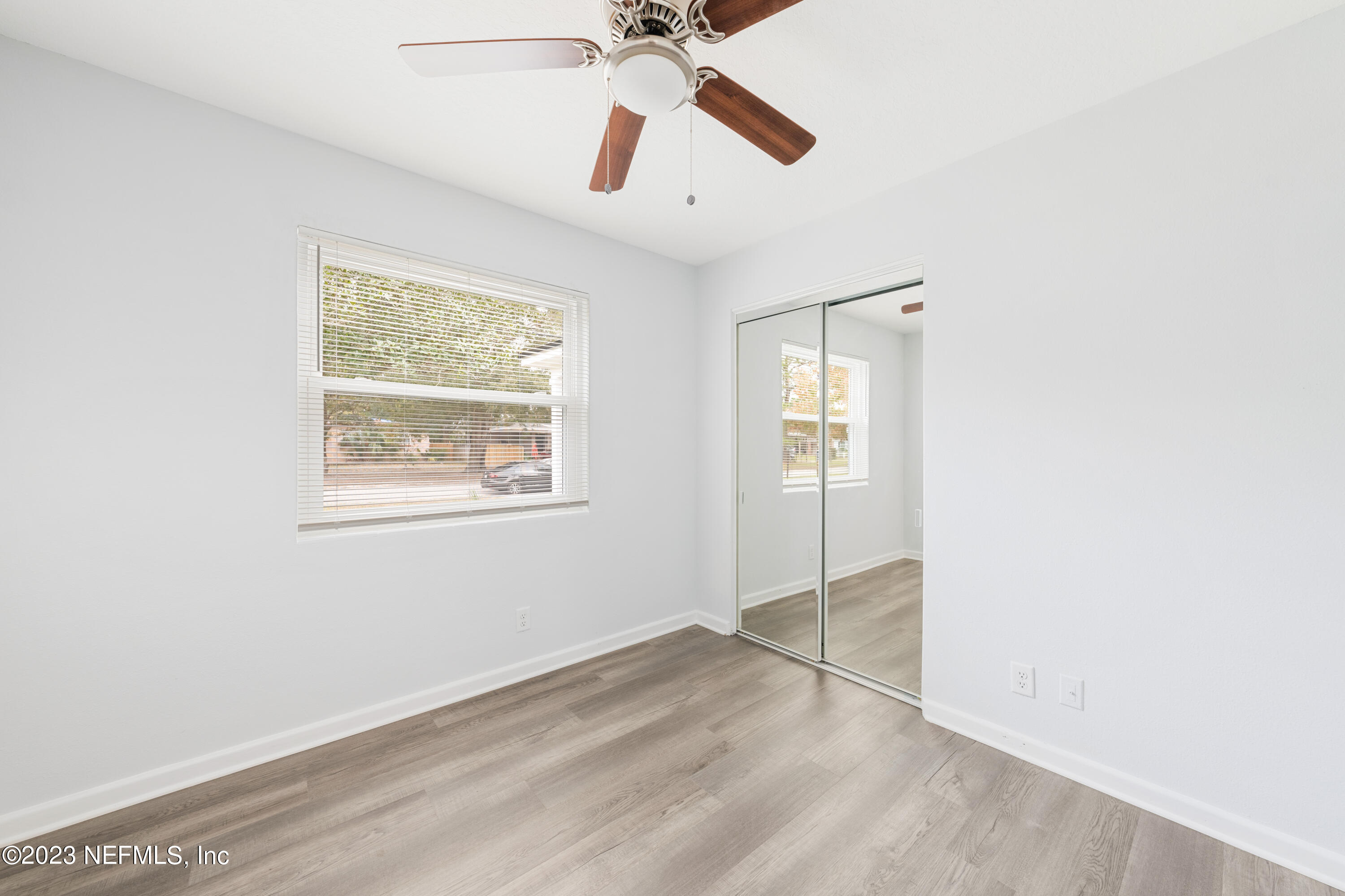2704 Devonwood Road Jacksonville, FL 32211 - Photo 16 of 31 an empty room with fan and windows