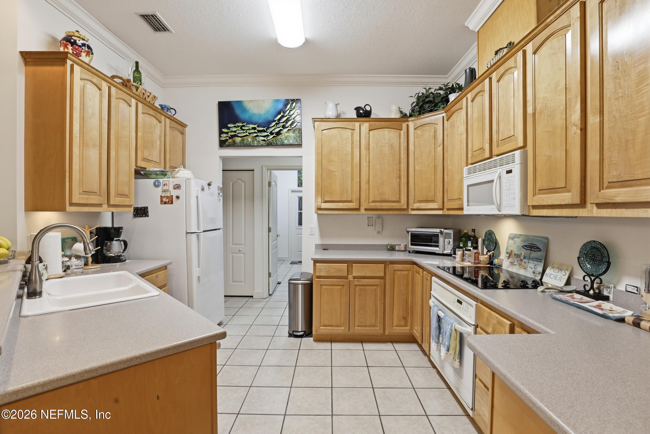 6455 Brooklyn Bay Road Keystone Heights, FL 32656 - Photo 14 of 50 a kitchen with stainless steel appliances granite countertop a sink stove and refrigerator
