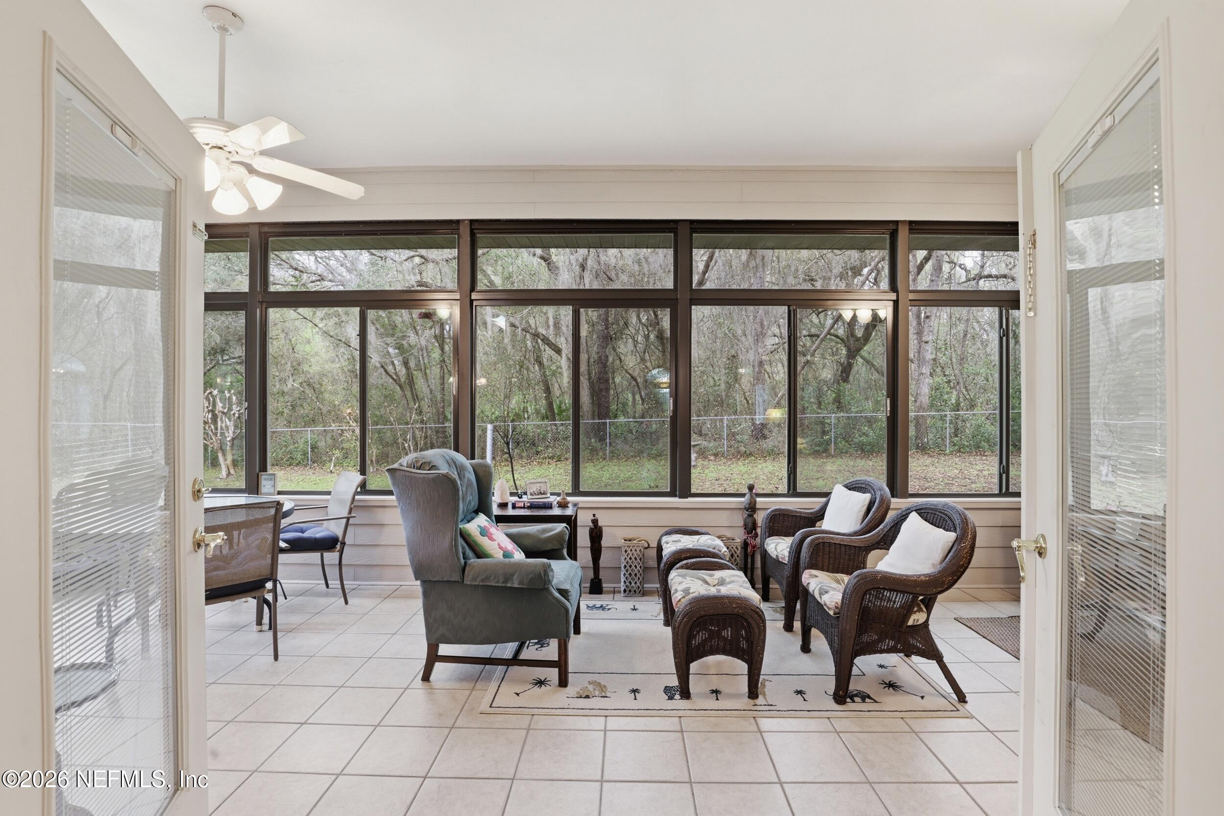 6455 Brooklyn Bay Road Keystone Heights, FL 32656 - Photo 15 of 50 a living room with furniture and a large window