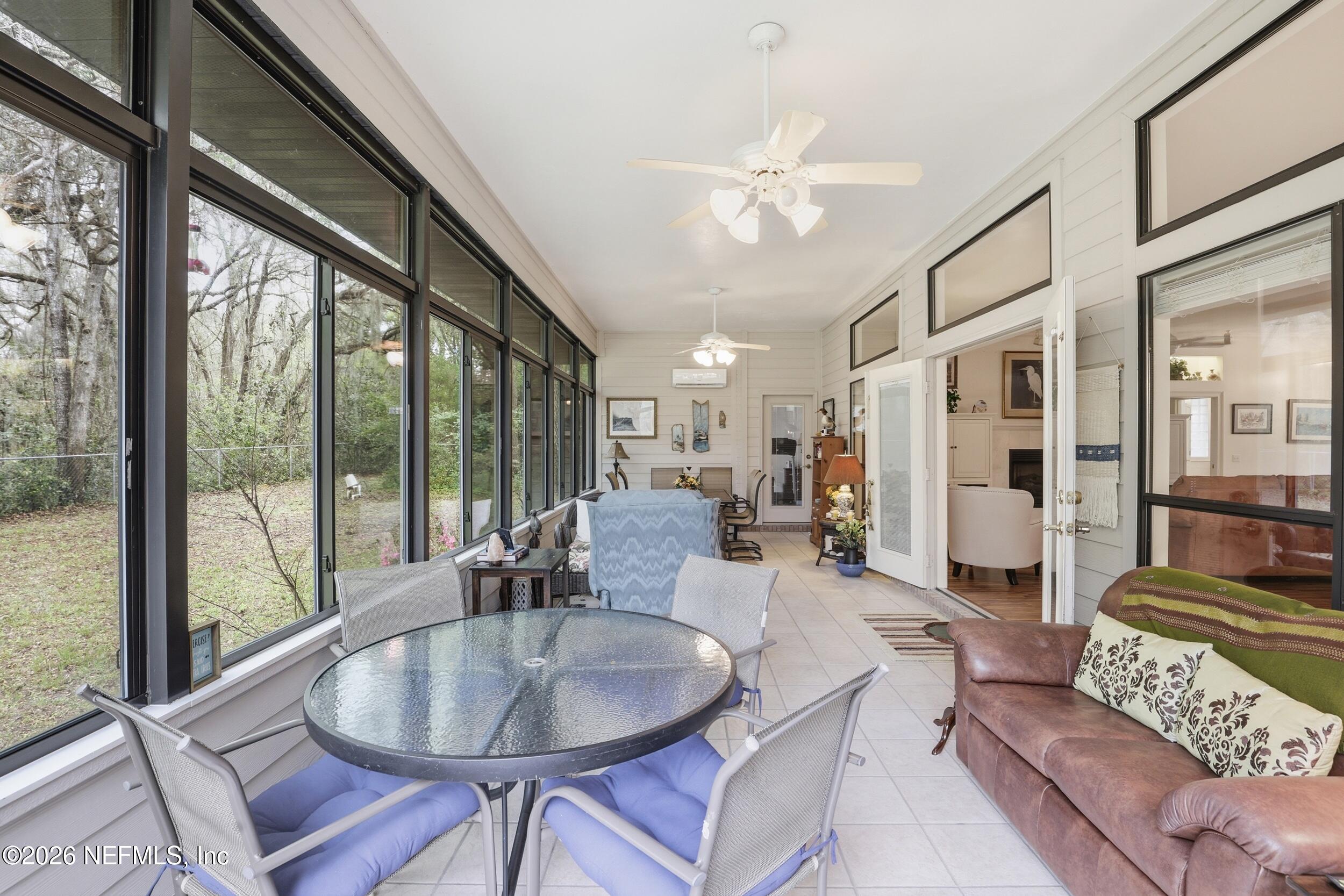 6455 Brooklyn Bay Road Keystone Heights, FL 32656 - Photo 16 of 50 a living room with furniture and a large window