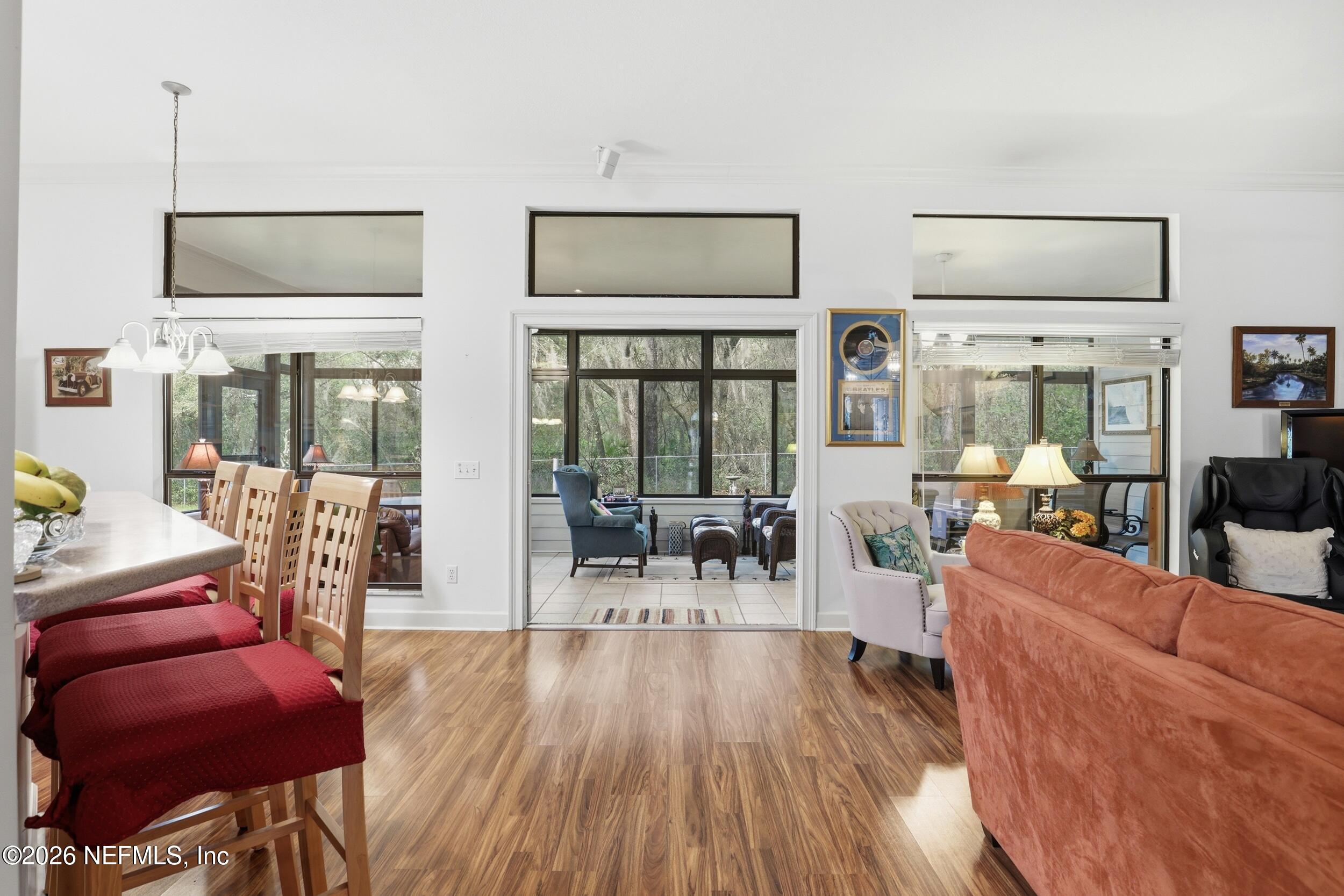 6455 Brooklyn Bay Road Keystone Heights, FL 32656 - Photo 19 of 50 a living room with furniture and a wooden floor