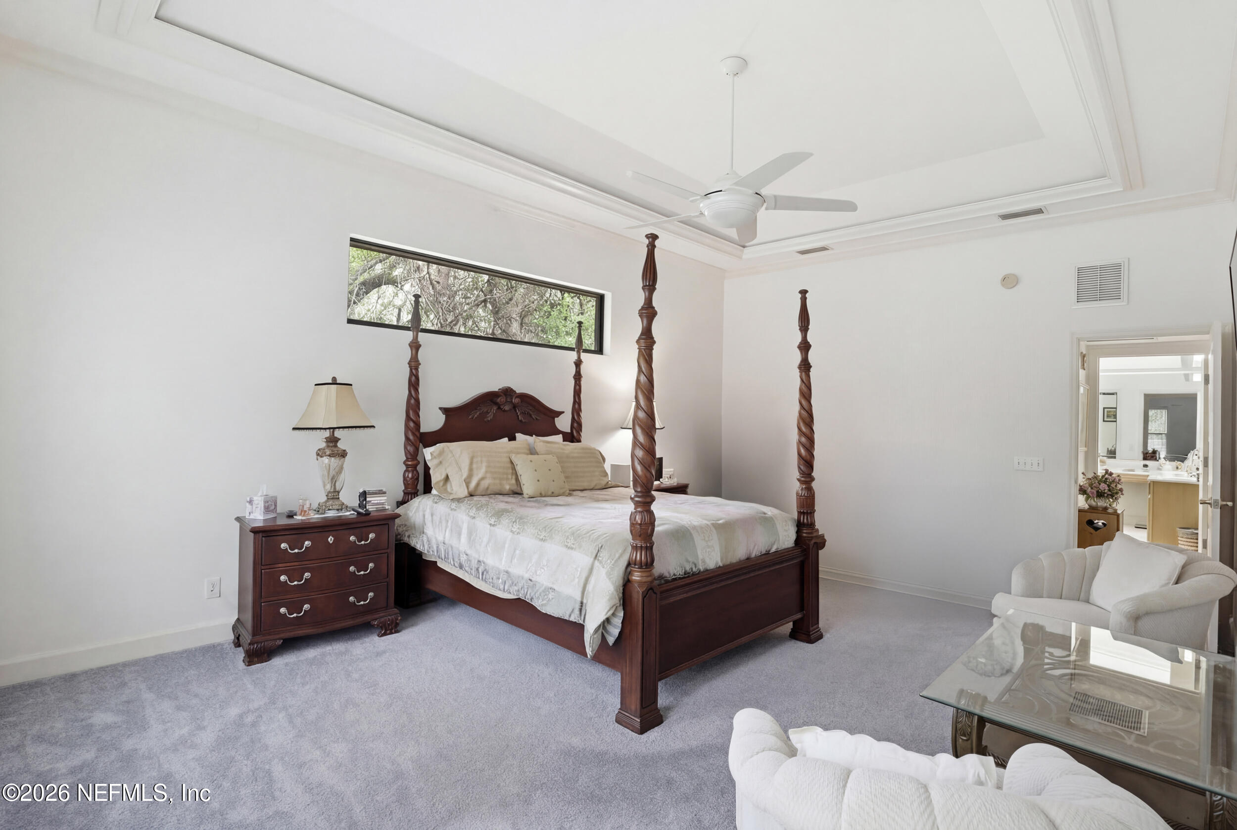 6455 Brooklyn Bay Road Keystone Heights, FL 32656 - Photo 21 of 50 a bedroom with a bed and a chair