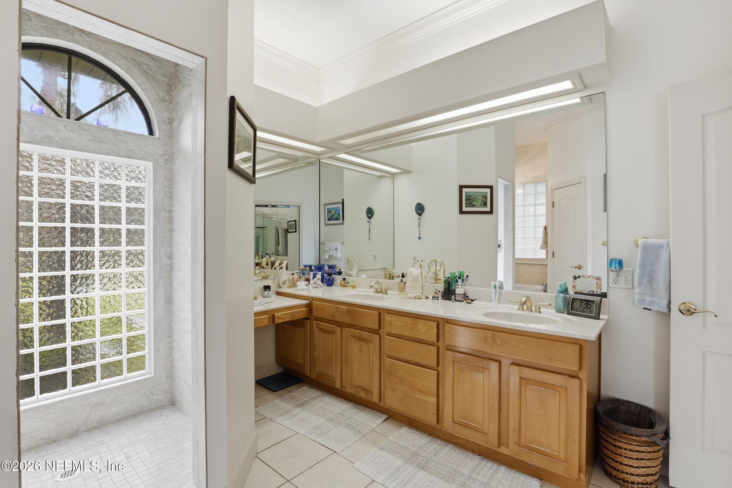 6455 Brooklyn Bay Road Keystone Heights, FL 32656 - Photo 23 of 50 a spacious bathroom with a double vanity sink mirror and