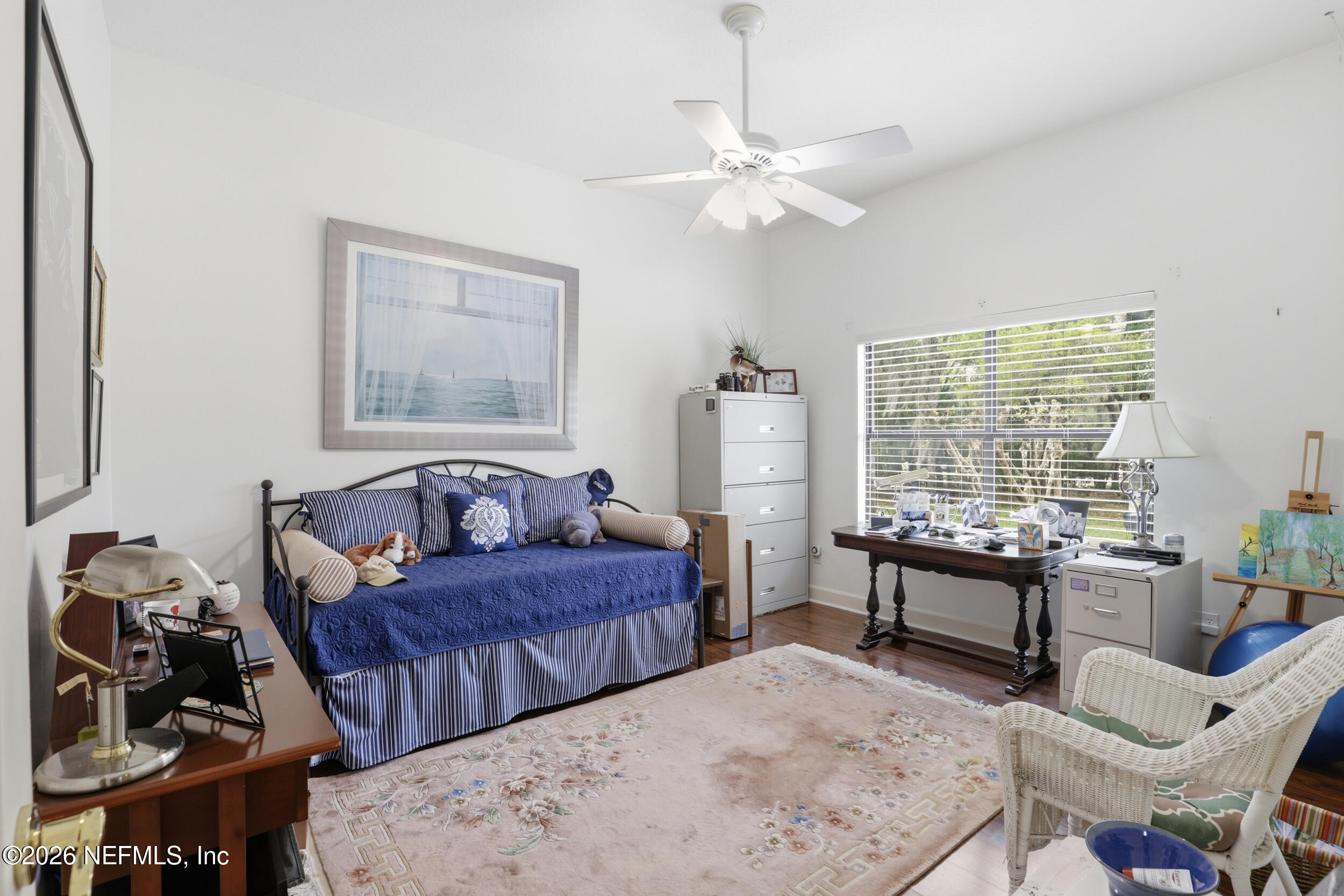 6455 Brooklyn Bay Road Keystone Heights, FL 32656 - Photo 25 of 50 a bedroom with two beds and a large mirror next to a window