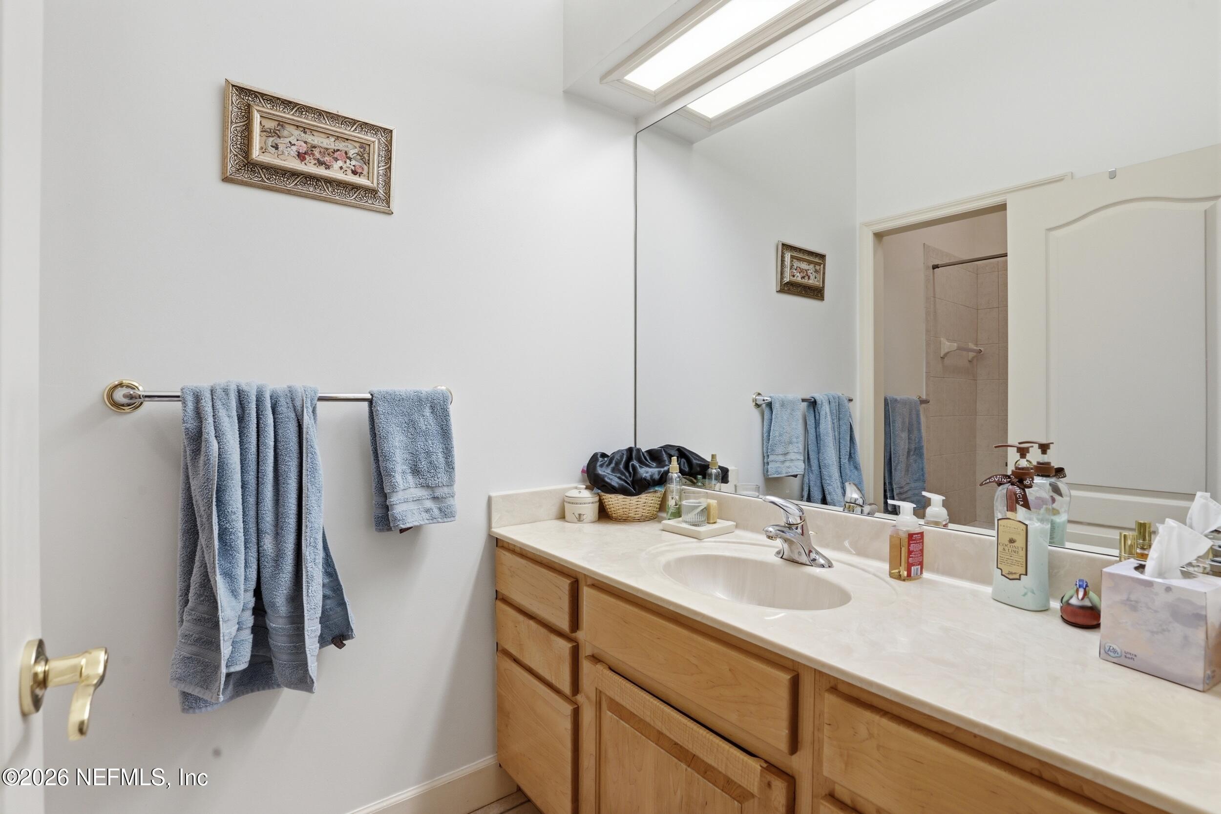 6455 Brooklyn Bay Road Keystone Heights, FL 32656 - Photo 26 of 50 a bathroom with a sink and a mirror