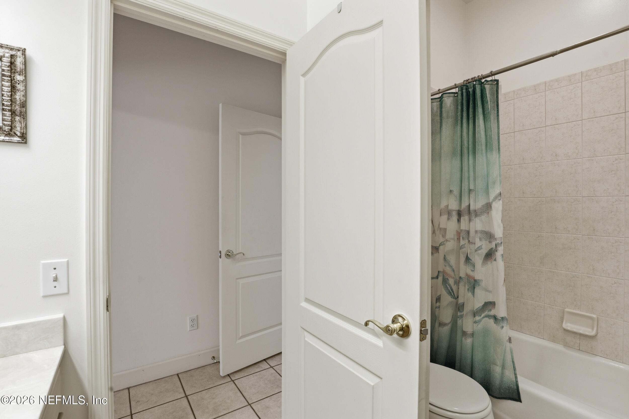 6455 Brooklyn Bay Road Keystone Heights, FL 32656 - Photo 27 of 50 a bathroom with a shower and a toilet
