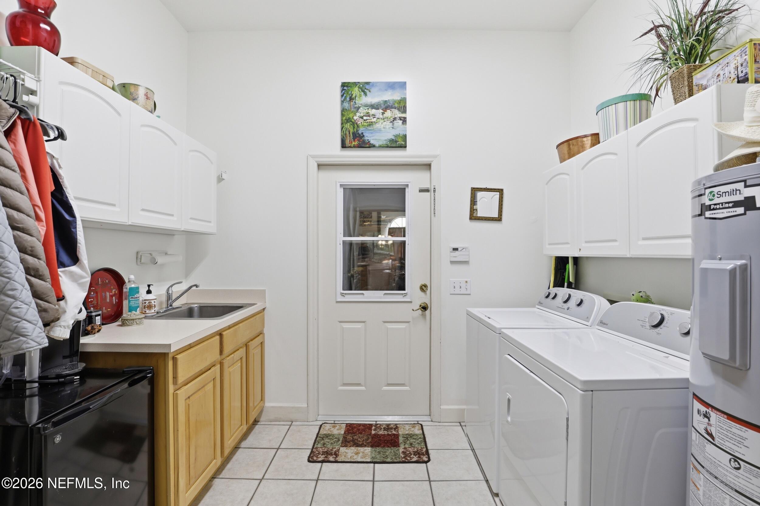6455 Brooklyn Bay Road Keystone Heights, FL 32656 - Photo 29 of 50 a utility room with sink dryer and washer