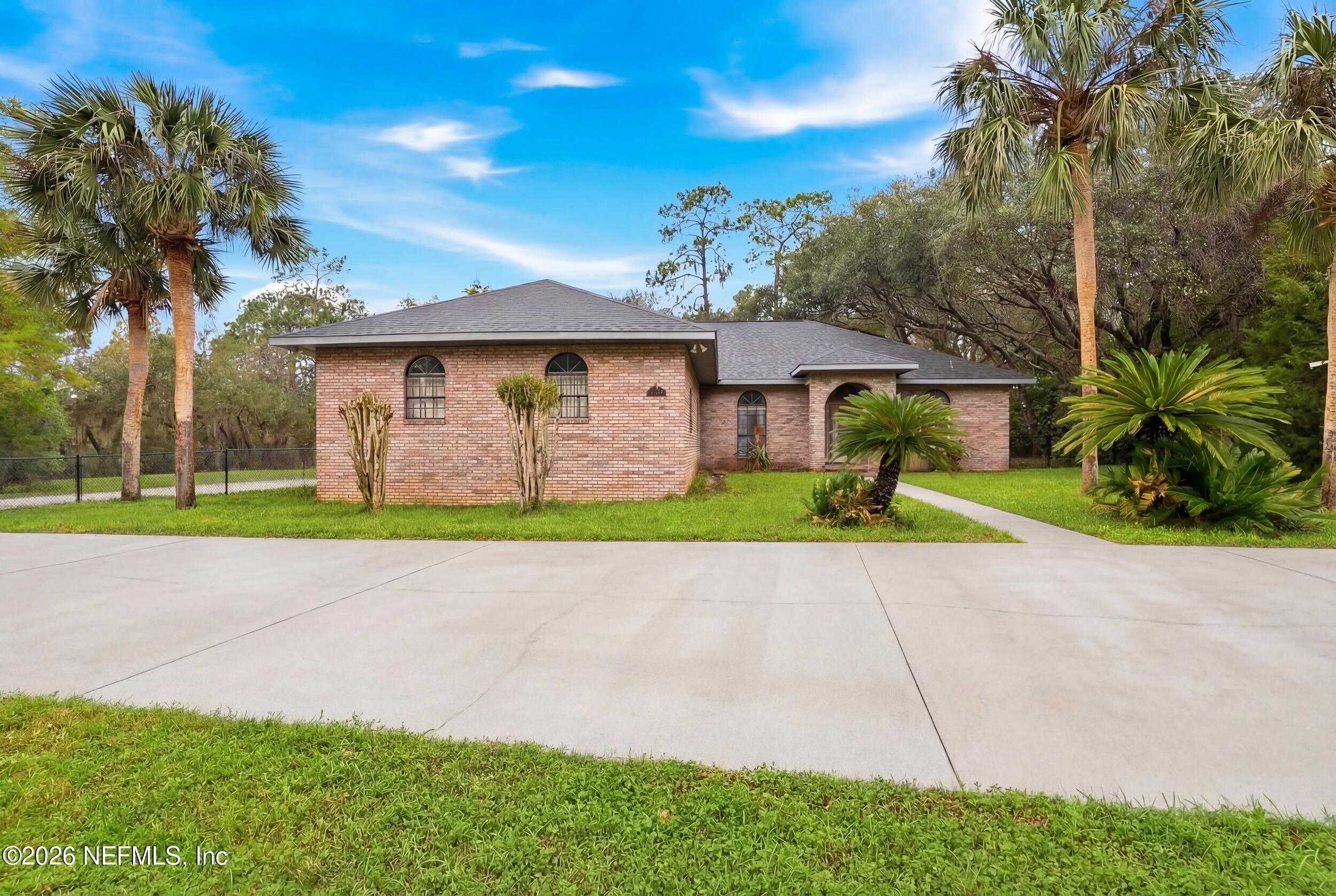 6455 Brooklyn Bay Road Keystone Heights, FL 32656 - Photo 3 of 50 a view of a house with a yard and potted plants