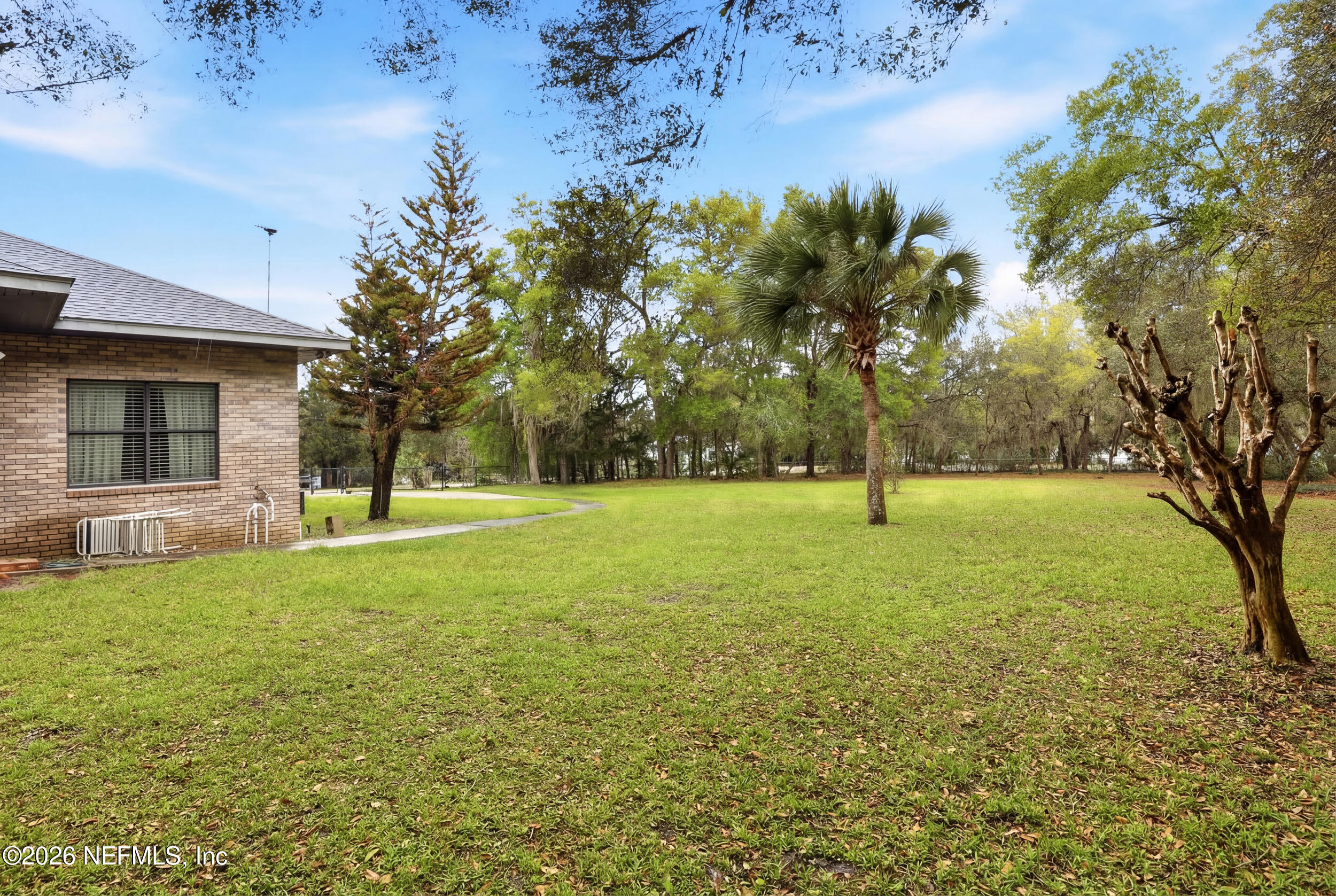6455 Brooklyn Bay Road Keystone Heights, FL 32656 - Photo 32 of 50 a view of a house with yard and tree s
