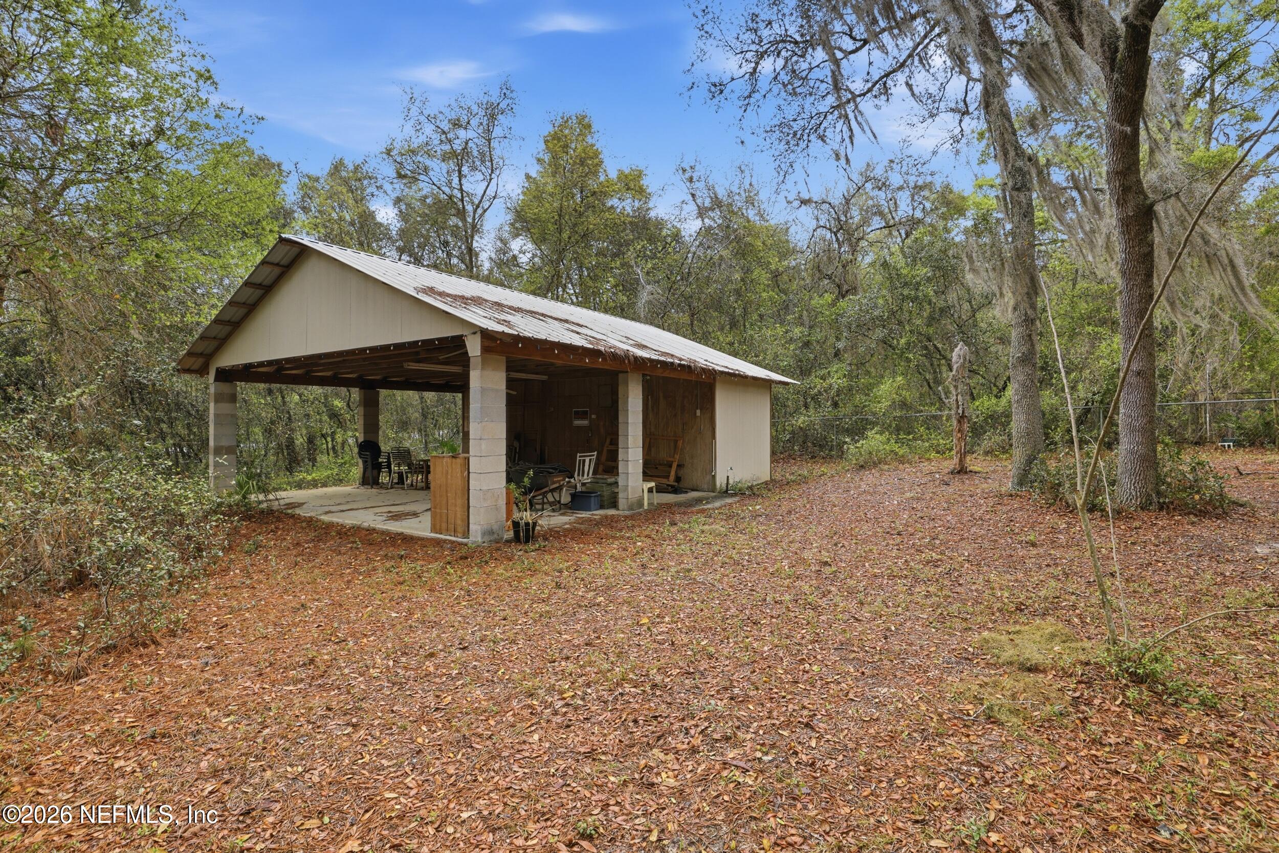 6455 Brooklyn Bay Road Keystone Heights, FL 32656 - Photo 34 of 50 a view of a house with a yard and tree s
