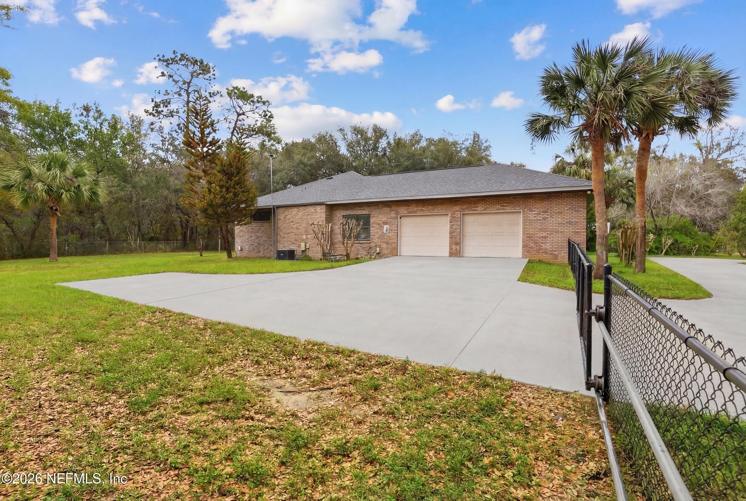6455 Brooklyn Bay Road Keystone Heights, FL 32656 - Photo 39 of 50 a front view of a house with a yard and mountain view
