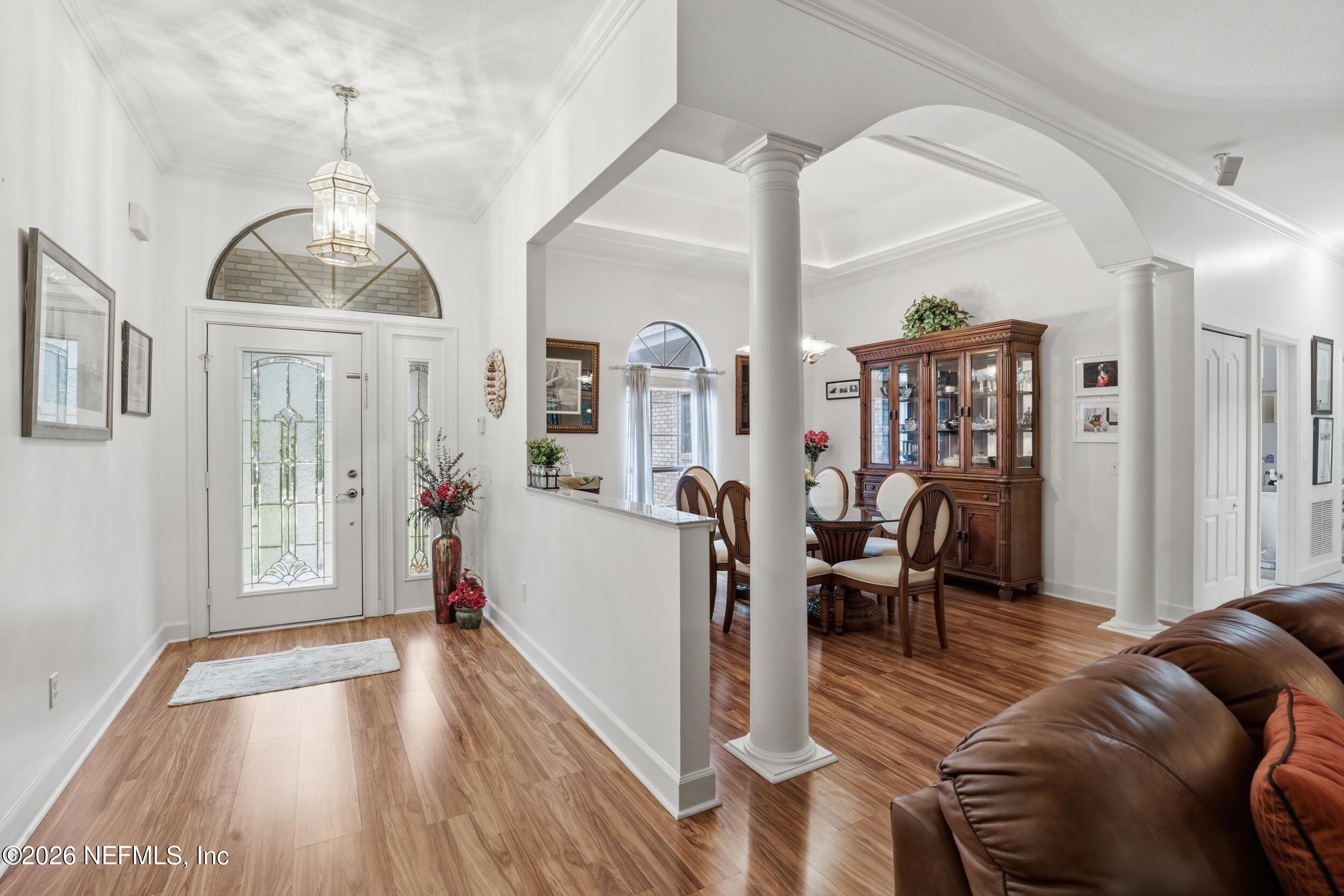 6455 Brooklyn Bay Road Keystone Heights, FL 32656 - Photo 4 of 50 a living room with furniture a fireplace and wooden floor
