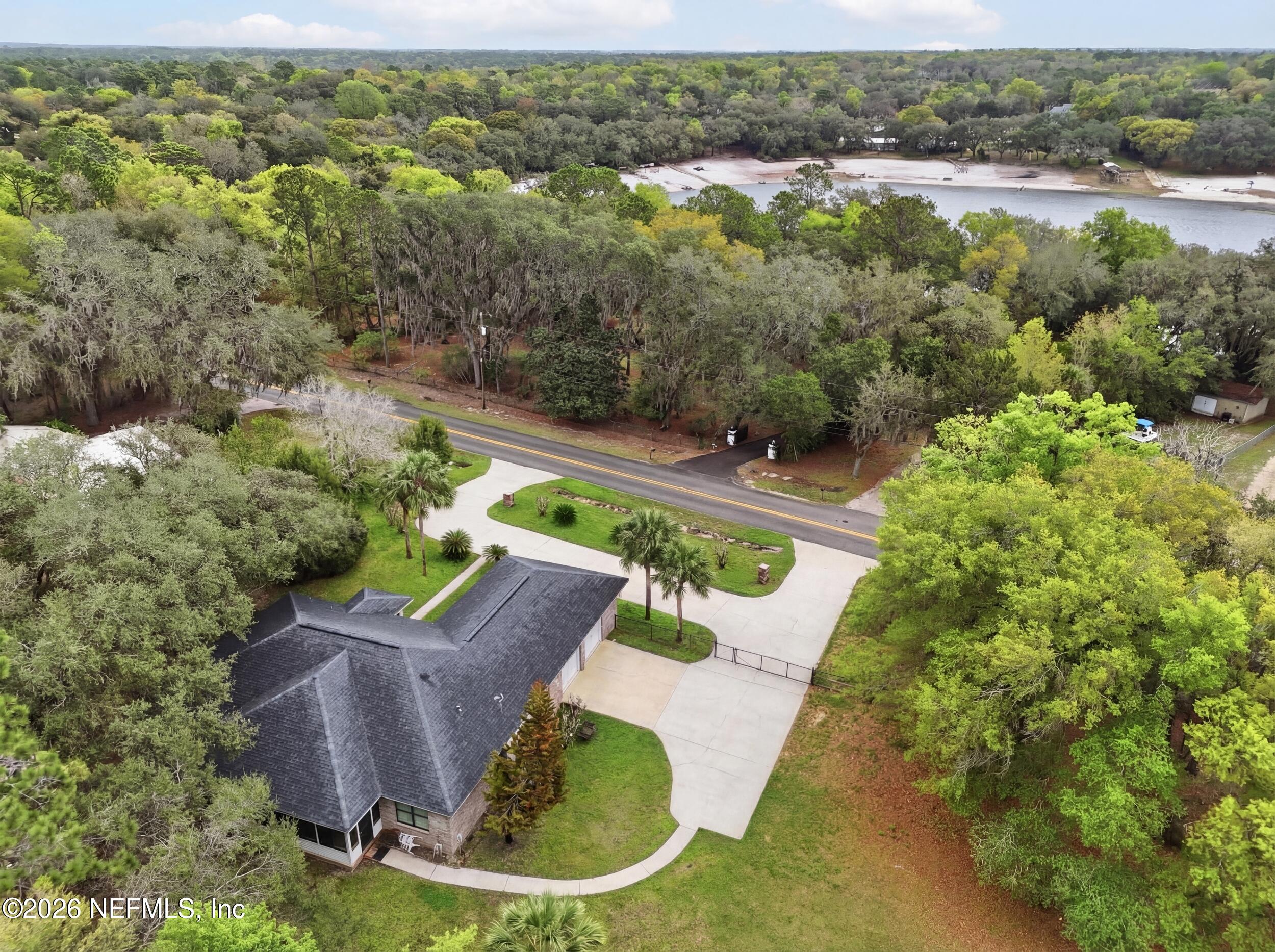 6455 Brooklyn Bay Road Keystone Heights, FL 32656 - Photo 42 of 50 a view of a swimming pool with a yard