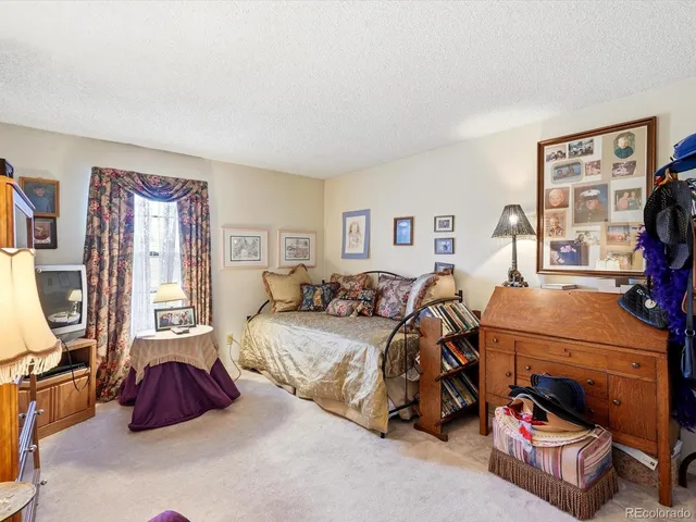 a bedroom with furniture and a bed