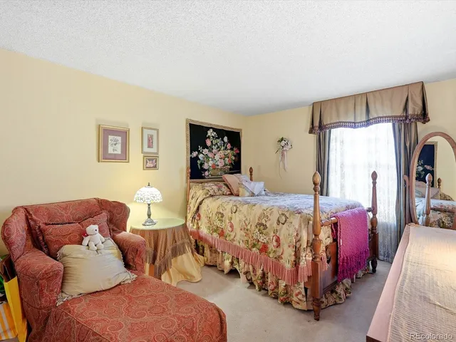 a bed room with bed and a couch