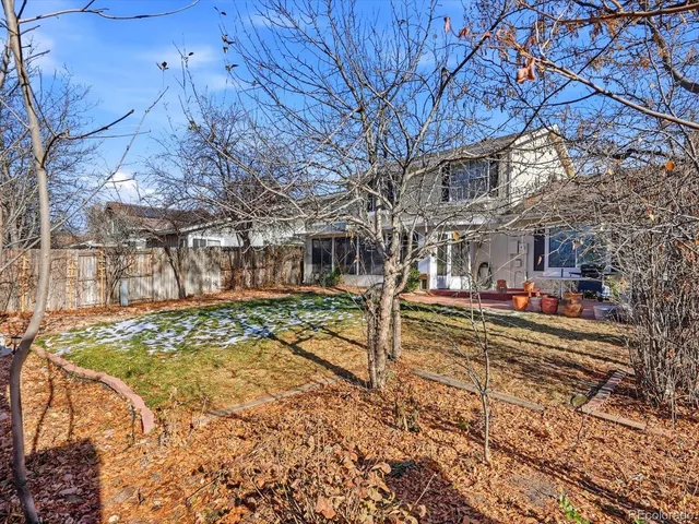 a front view of a building with a yard