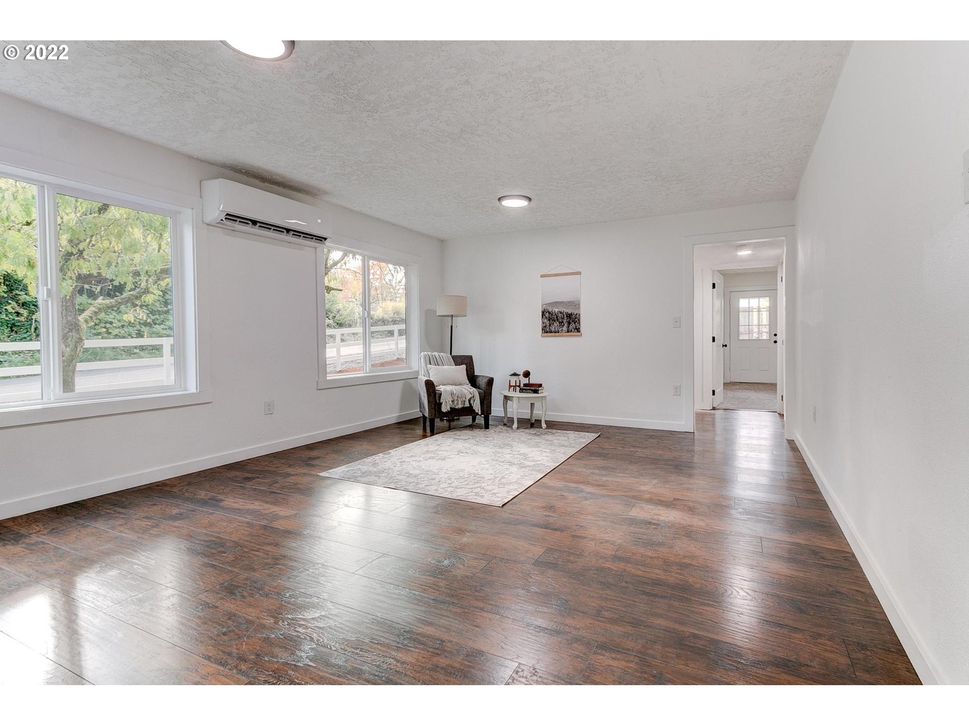 33719 Bennett Road Warren, OR 97053 - Photo 17 of 32 a view of an empty room with wooden floor and a window